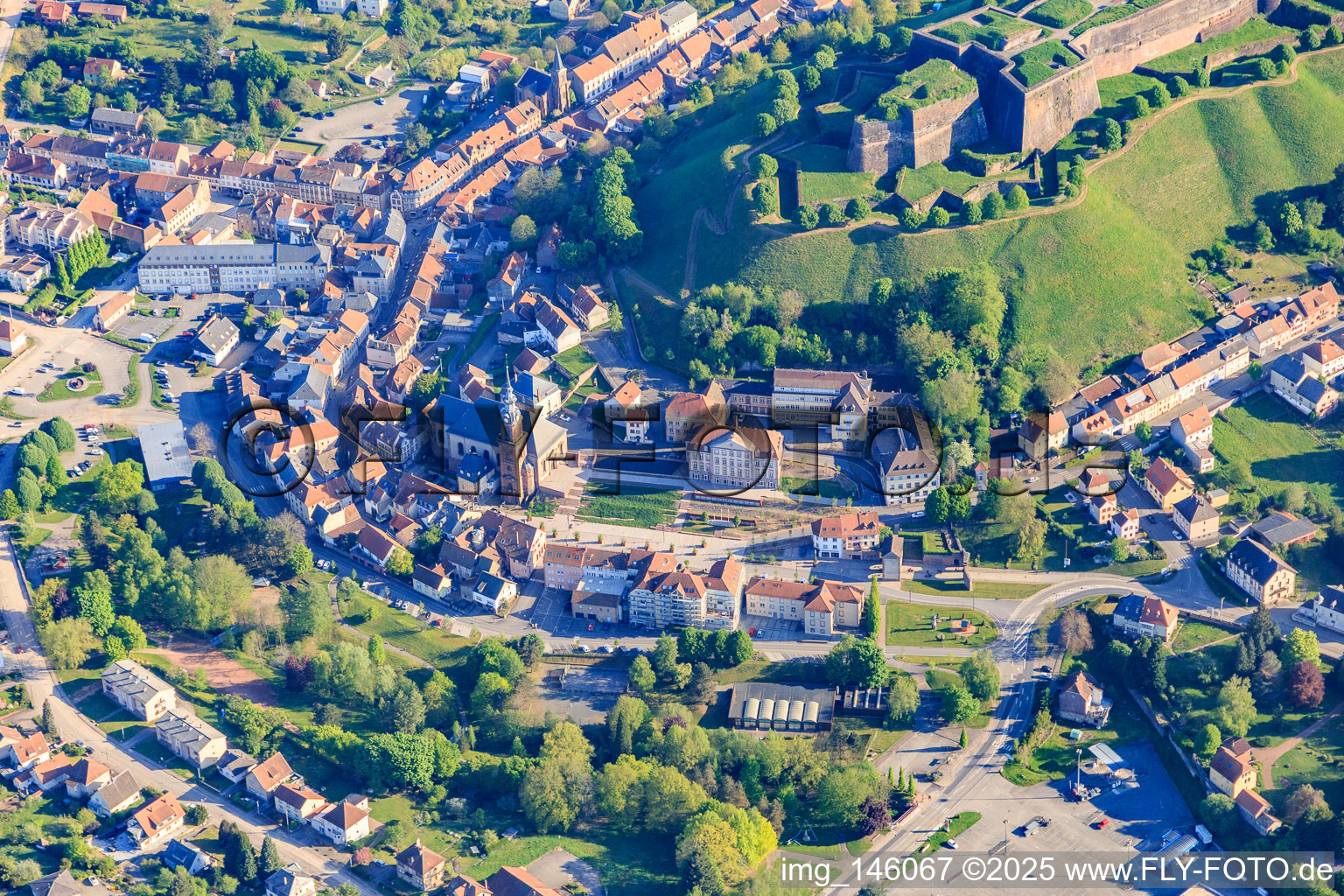 Town center with town hall and church in Bitsch in the state Moselle, France