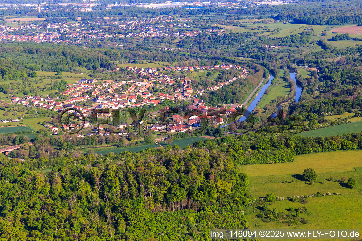 View of the town on the Saar and the Canal des houllères de la Sarre from the southeast in Wittring in the state Moselle, France
