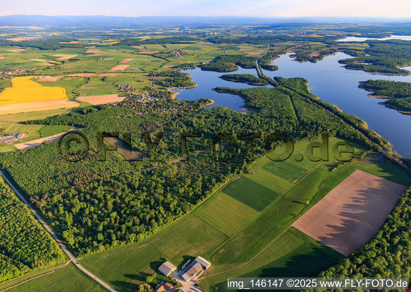 Aerial view of Canal des houllères de la Sarre crosses the lakes Ètang des femmes and Stockweiher in Langatte in the state Moselle, France