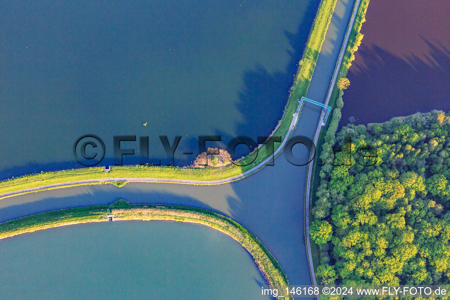 Intersection of the two canals, the Rhine-Marne Canal and the Canal des houllères de la Sarre, in the lakes Le Petit Étang and Le Grand Ruisseau with crossing for cyclists and pedestrians in Gondrexange in the state Moselle, France