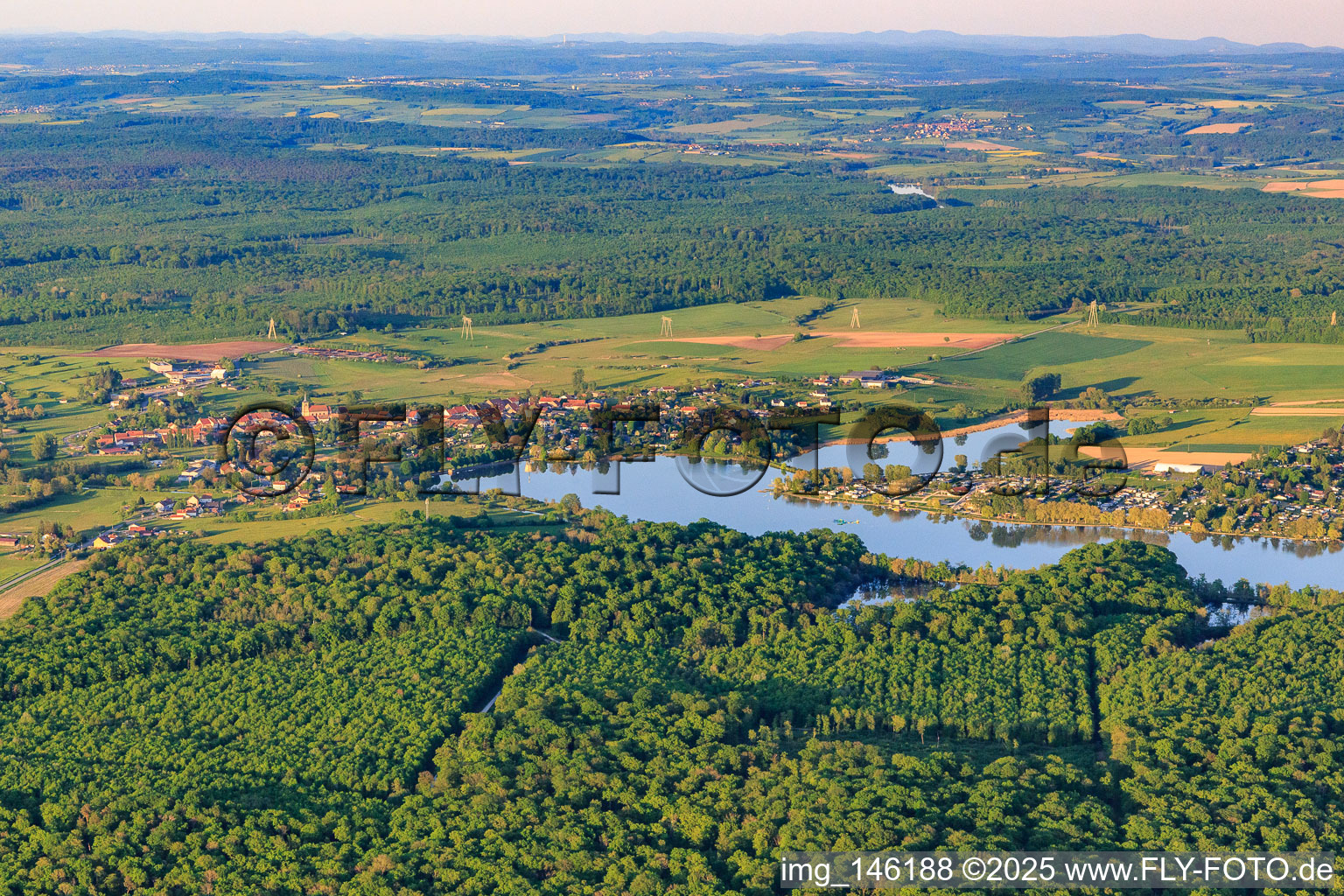 View of the town at Lake Mittersheim from the west in Mittersheim in the state Moselle, France