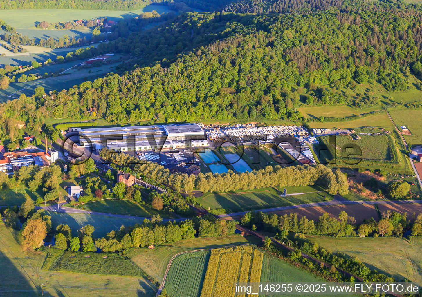 Aerial view of Production halls of HOFMANN NATURSTEIN GmbH & Co. KG in the district Gamburg in Werbach in the state Baden-Wuerttemberg, Germany