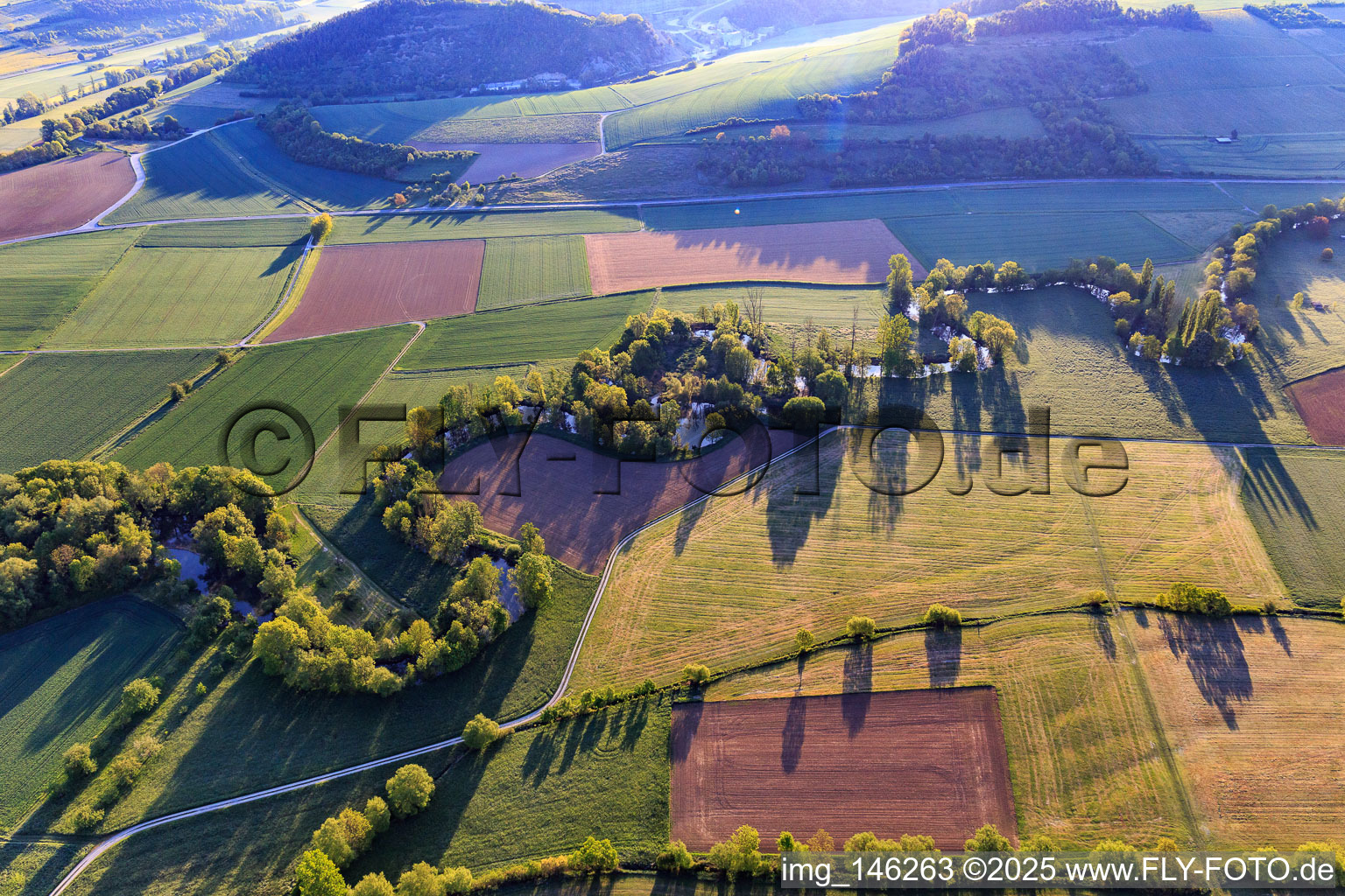 Meandering river course in the lovely Tauber valley in the morning from the west in the district Hochhausen in Tauberbischofsheim in the state Baden-Wuerttemberg, Germany