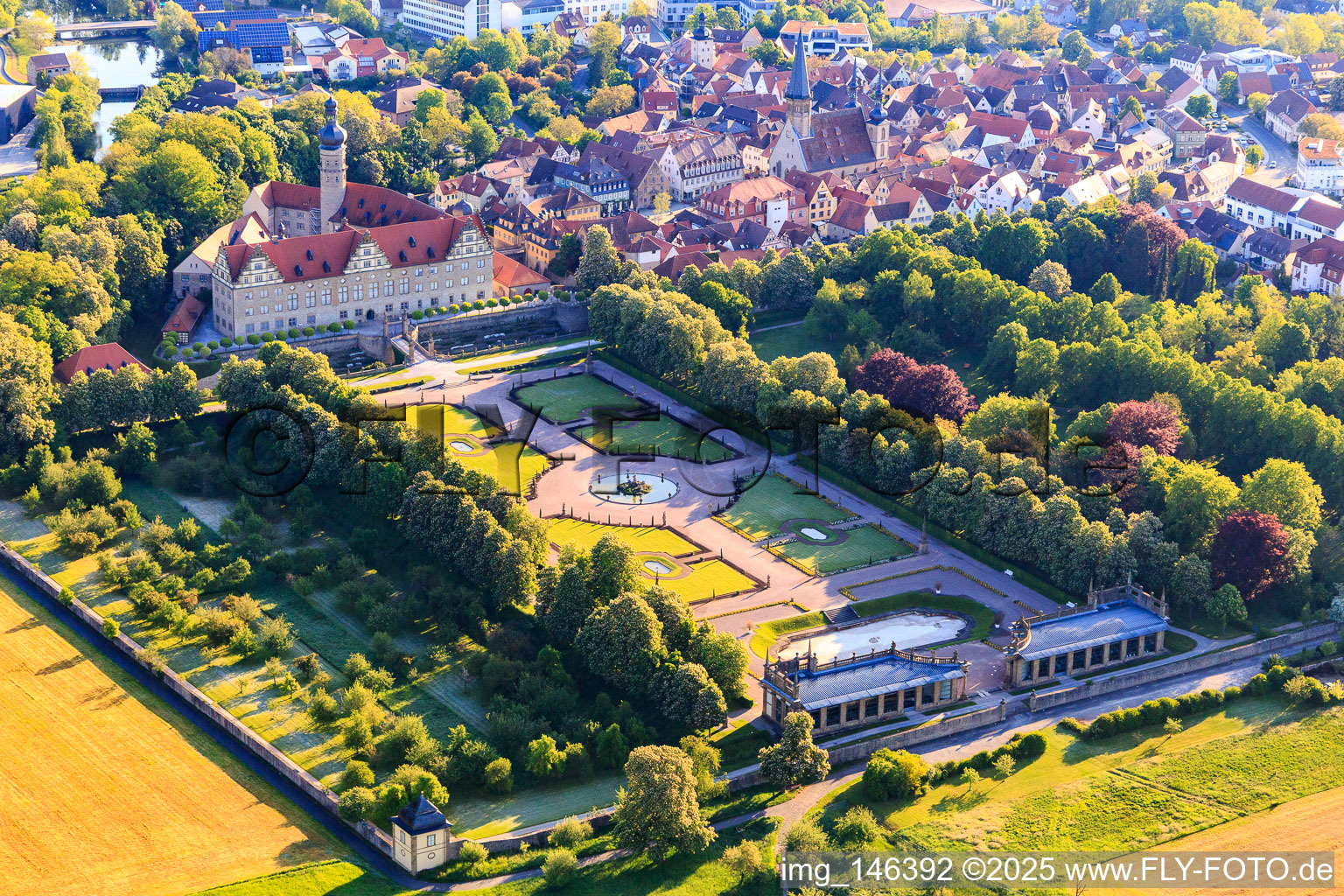 Aerial photograpy of Castle and castle garden Weikersheim (Castle of Count Wolfgang von Hohenlohe from the 17th century with a magnificent knights' hall and garden with statues.) in Weikersheim in the state Baden-Wuerttemberg, Germany