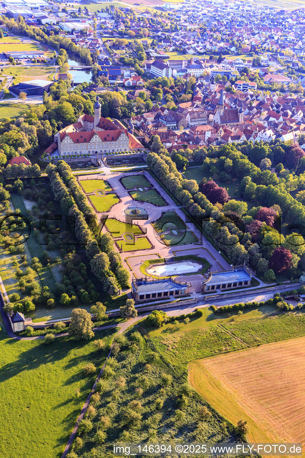 Castle and castle garden Weikersheim (Castle of Count Wolfgang von Hohenlohe from the 17th century with a magnificent knights' hall and garden with statues.) in Weikersheim in the state Baden-Wuerttemberg, Germany from above