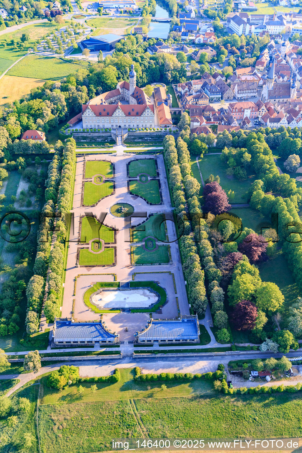 Castle and castle garden Weikersheim (Castle of Count Wolfgang von Hohenlohe from the 17th century with a magnificent knights' hall and garden with statues.) in Weikersheim in the state Baden-Wuerttemberg, Germany from the plane