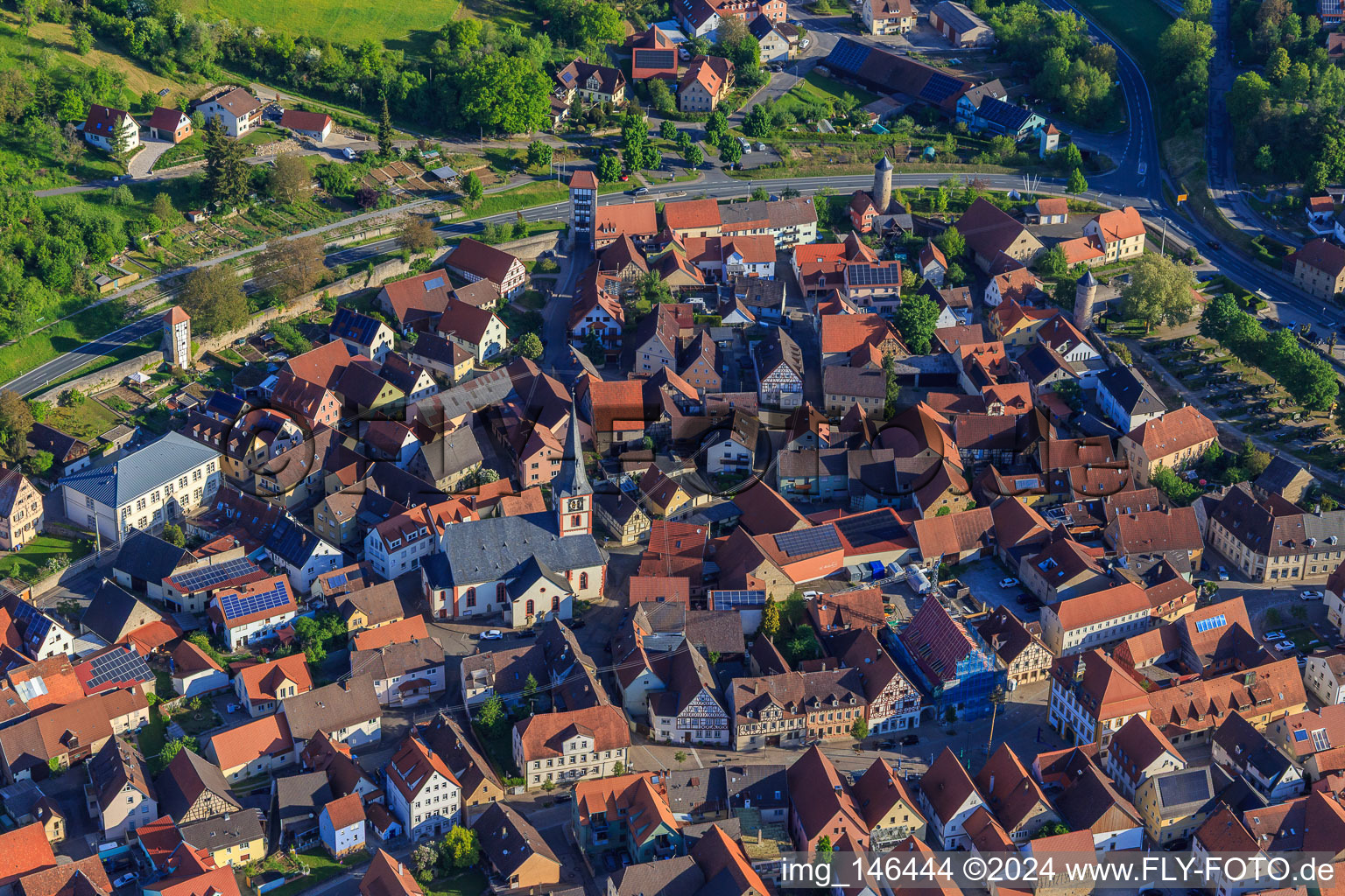 Aerial view of St. Kilian's Church in the village center in Röttingen in the state Bavaria, Germany