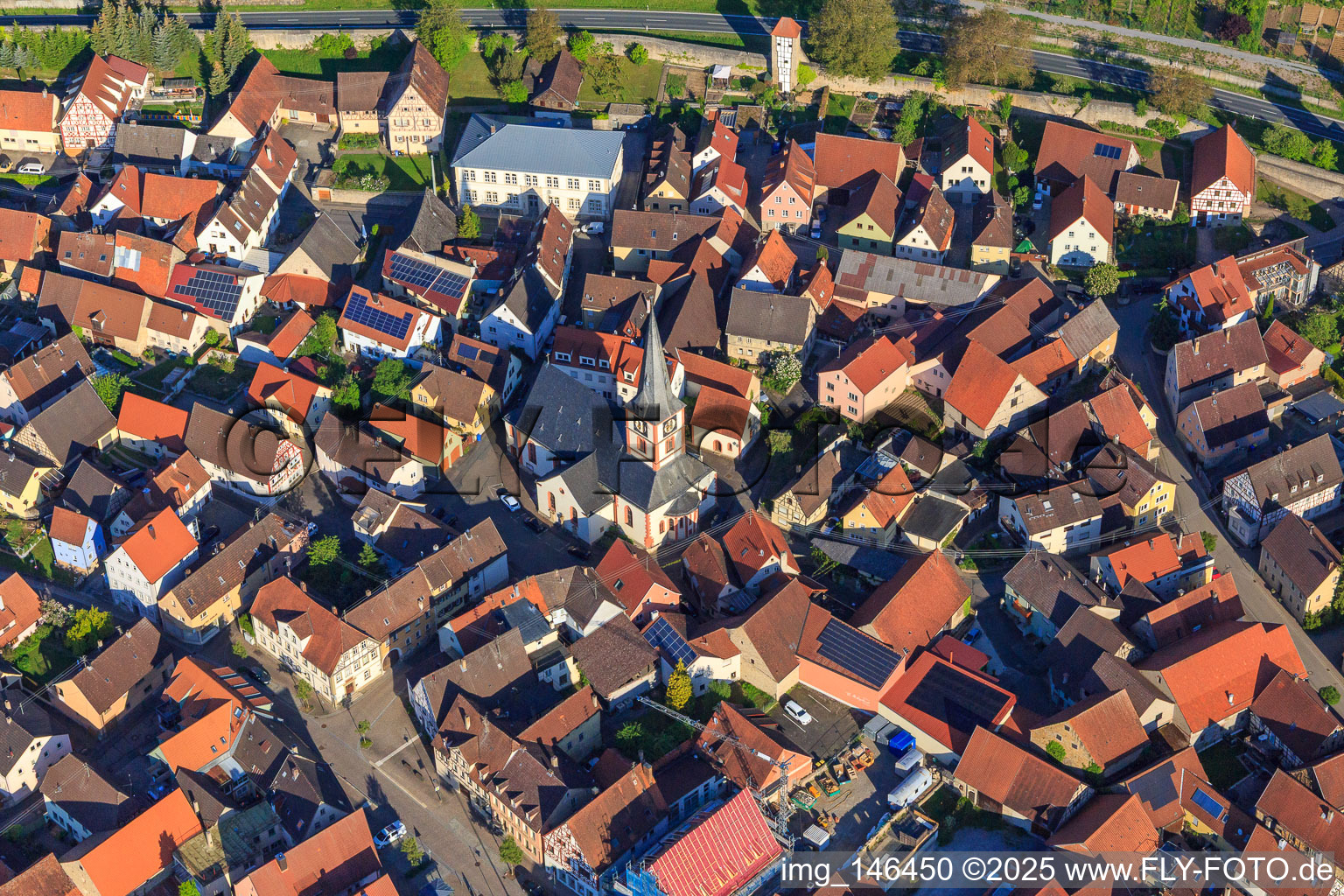 Aerial photograpy of St. Kilian's Church in the village center in Röttingen in the state Bavaria, Germany