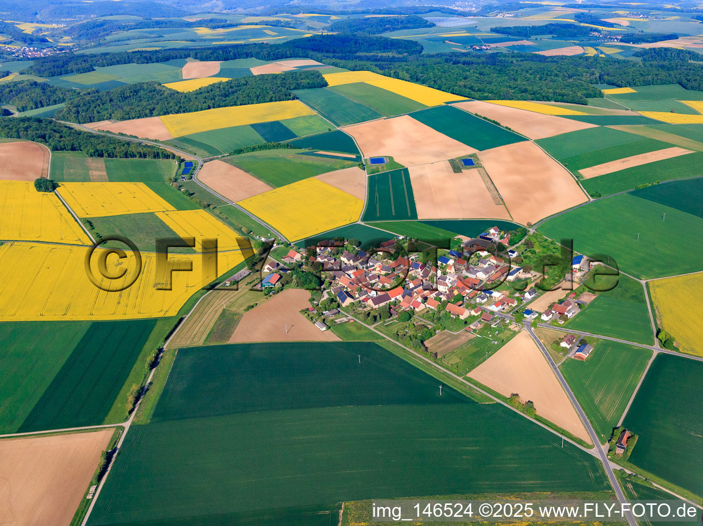 Village overview in the morning from the southeast in the district Oesfeld in Bütthard in the state Bavaria, Germany