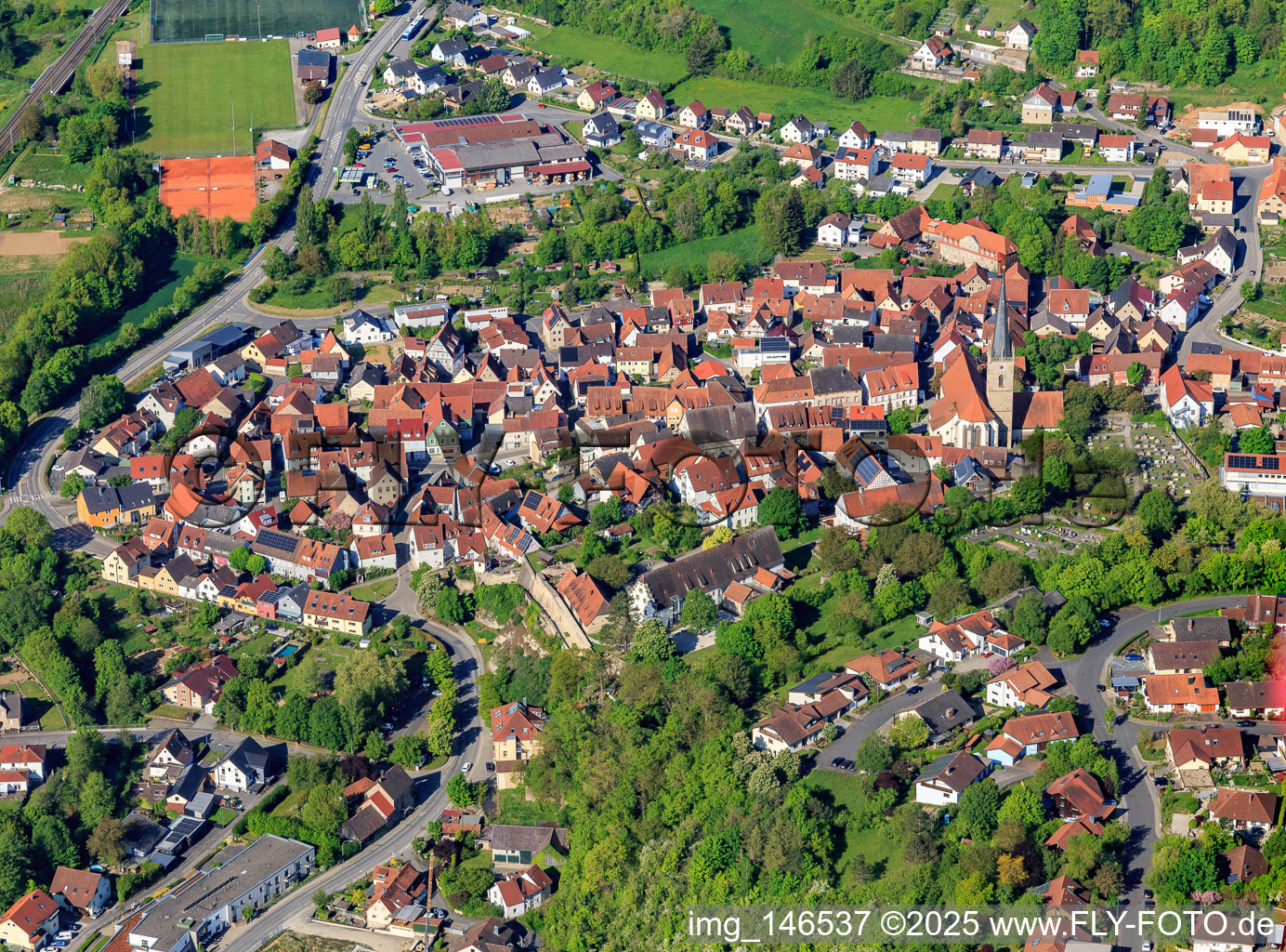 Town center with Church of St. Peter and Paul in Grünsfeld in the state Baden-Wuerttemberg, Germany
