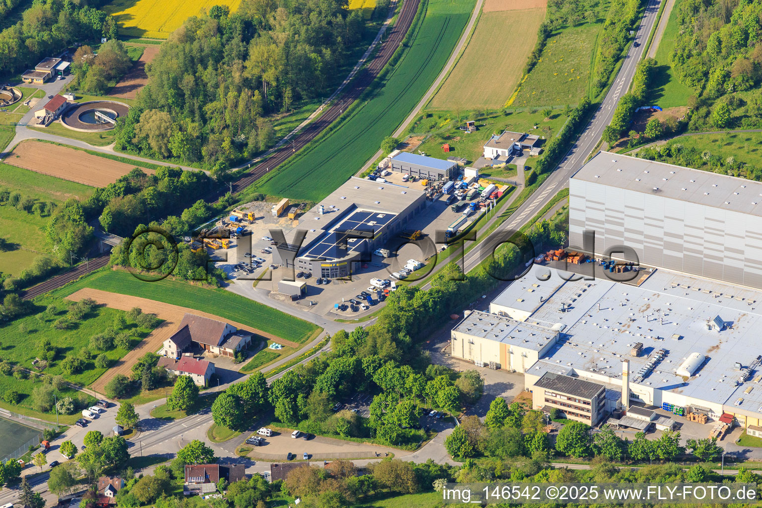 Aerial view of Refresco Deutschland GmbH and Autoservice Feuerstein in Grünsfeld in the state Baden-Wuerttemberg, Germany