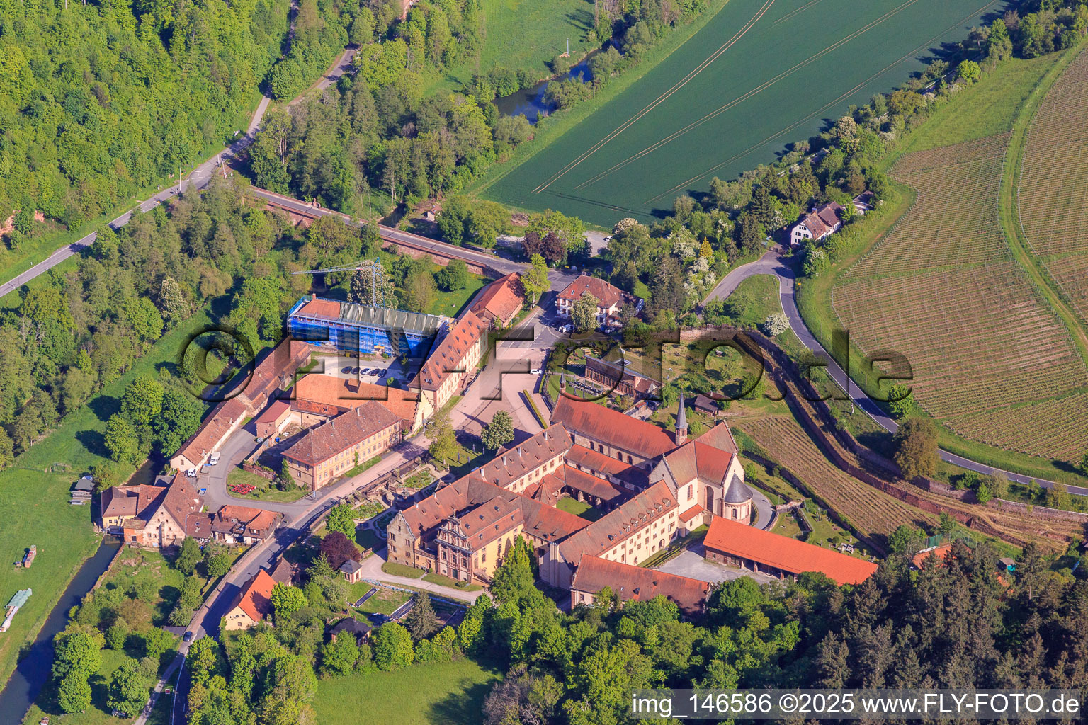 Aerial view of Hotel Kloster Bronnbach with Abbey Garden, Abbey Church of the Assumption of Mary and Missionaries of the Holy Family Monastery Bronnbach from the south in the district Bronnbach in Wertheim in the state Baden-Wuerttemberg, Germany
