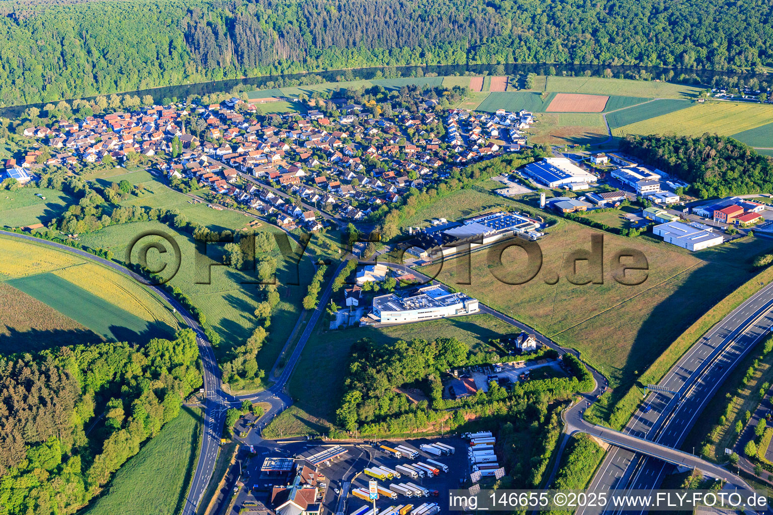 View of the town on the banks of the Main from the east in the district Bettingen in Wertheim in the state Baden-Wuerttemberg, Germany