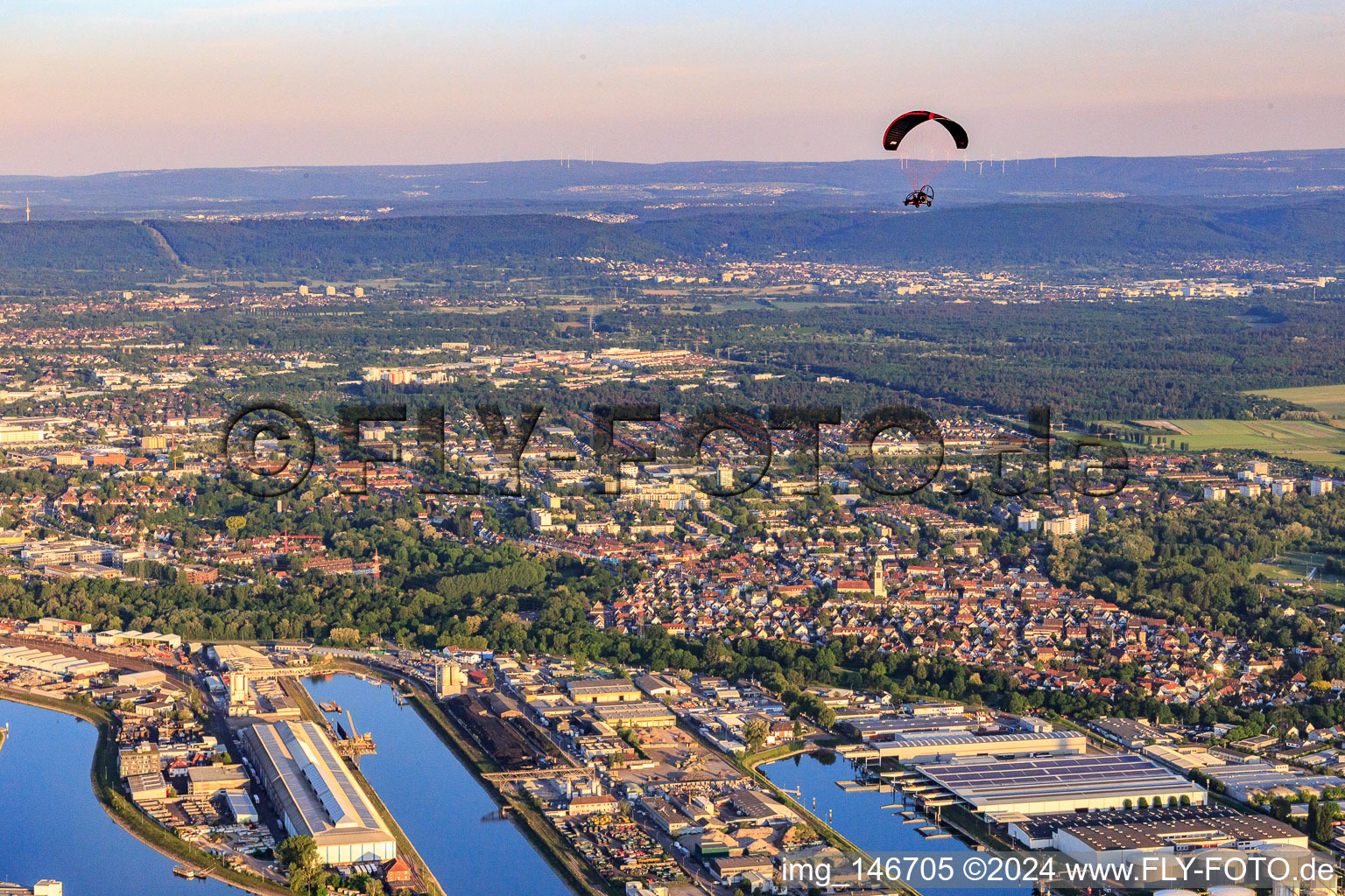 Rhine ports with paragliders in the evening in the district Mühlburg in Karlsruhe in the state Baden-Wuerttemberg, Germany