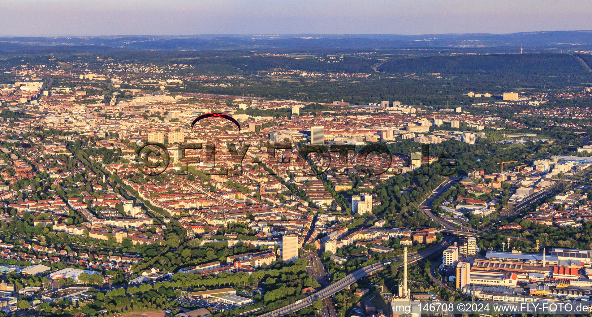 City view from the west with paraglider in the district Mühlburg in Karlsruhe in the state Baden-Wuerttemberg, Germany