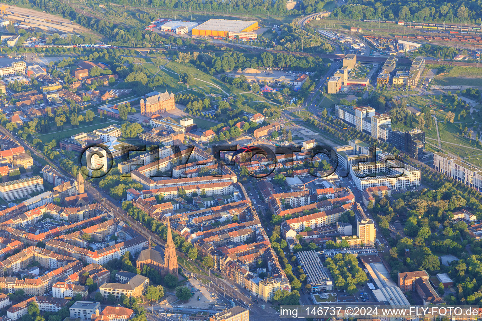 St. Bernhard Church on Durlacher Allee and Gottesauer Straße with paraglider in the district Oststadt in Karlsruhe in the state Baden-Wuerttemberg, Germany