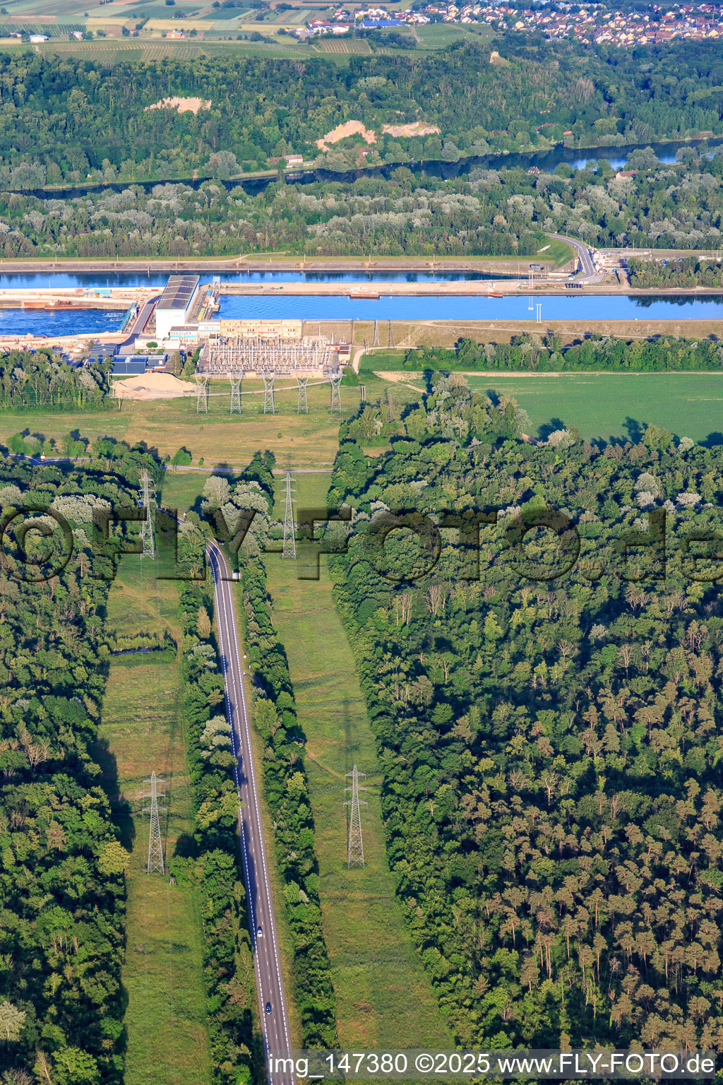 Road to the Rhine lock with hydroelectric power plant Marckolsheim of EDF in Marckolsheim in the state Bas-Rhin, France