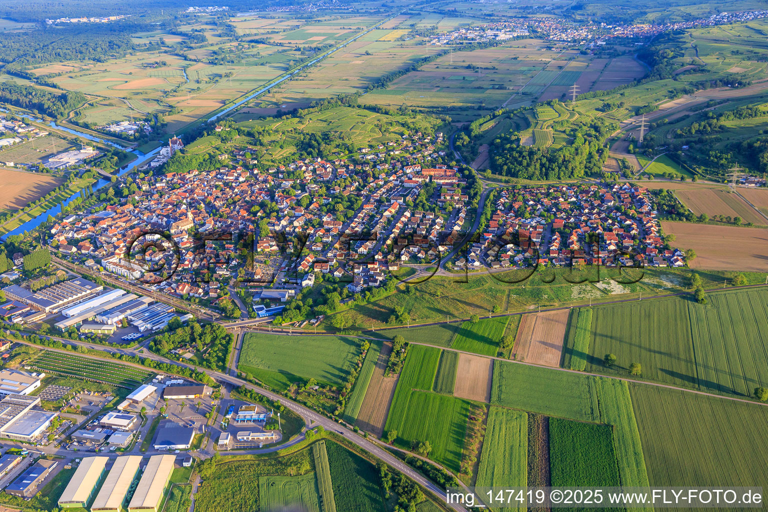 City overview at the Leopold Canal from the north in Riegel am Kaiserstuhl in the state Baden-Wuerttemberg, Germany