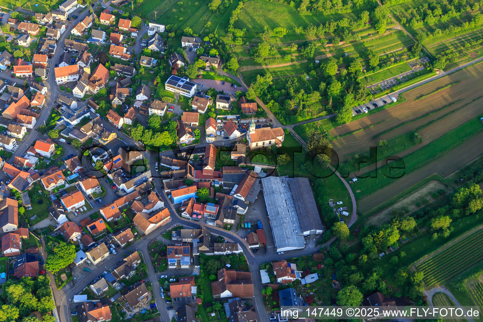 Village view with Abdeckfuchs24 GmbH and St. Sebastian Church in the district Bombach in Kenzingen in the state Baden-Wuerttemberg, Germany