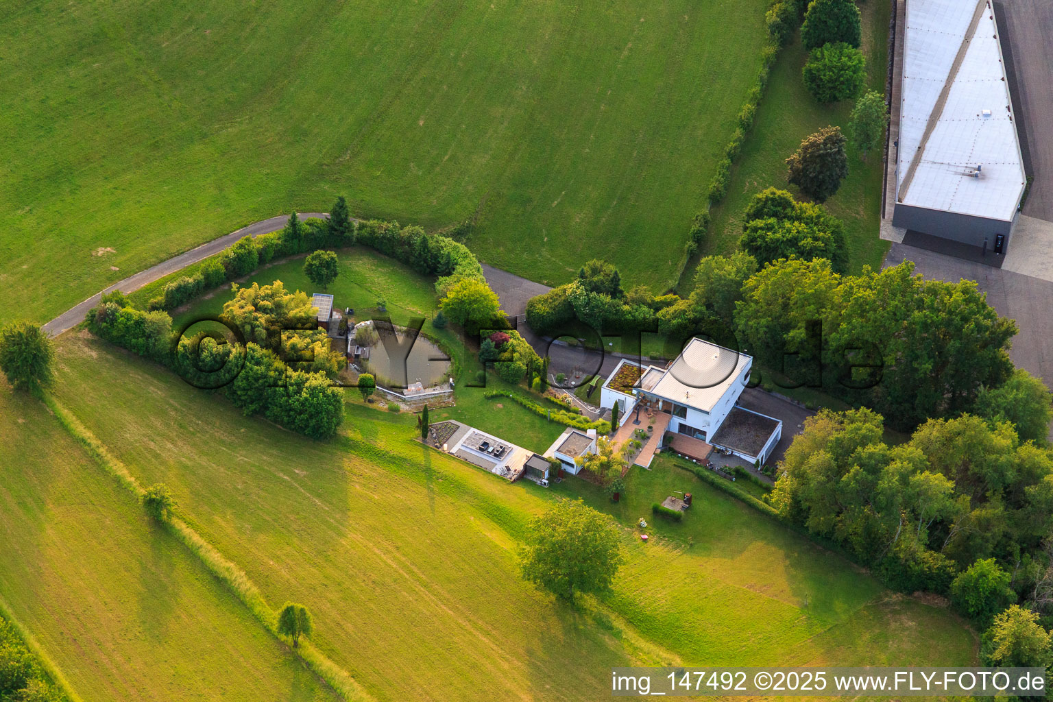 Villa with pond on Kippenheimer Straße in the district Schmieheim in Kippenheim in the state Baden-Wuerttemberg, Germany