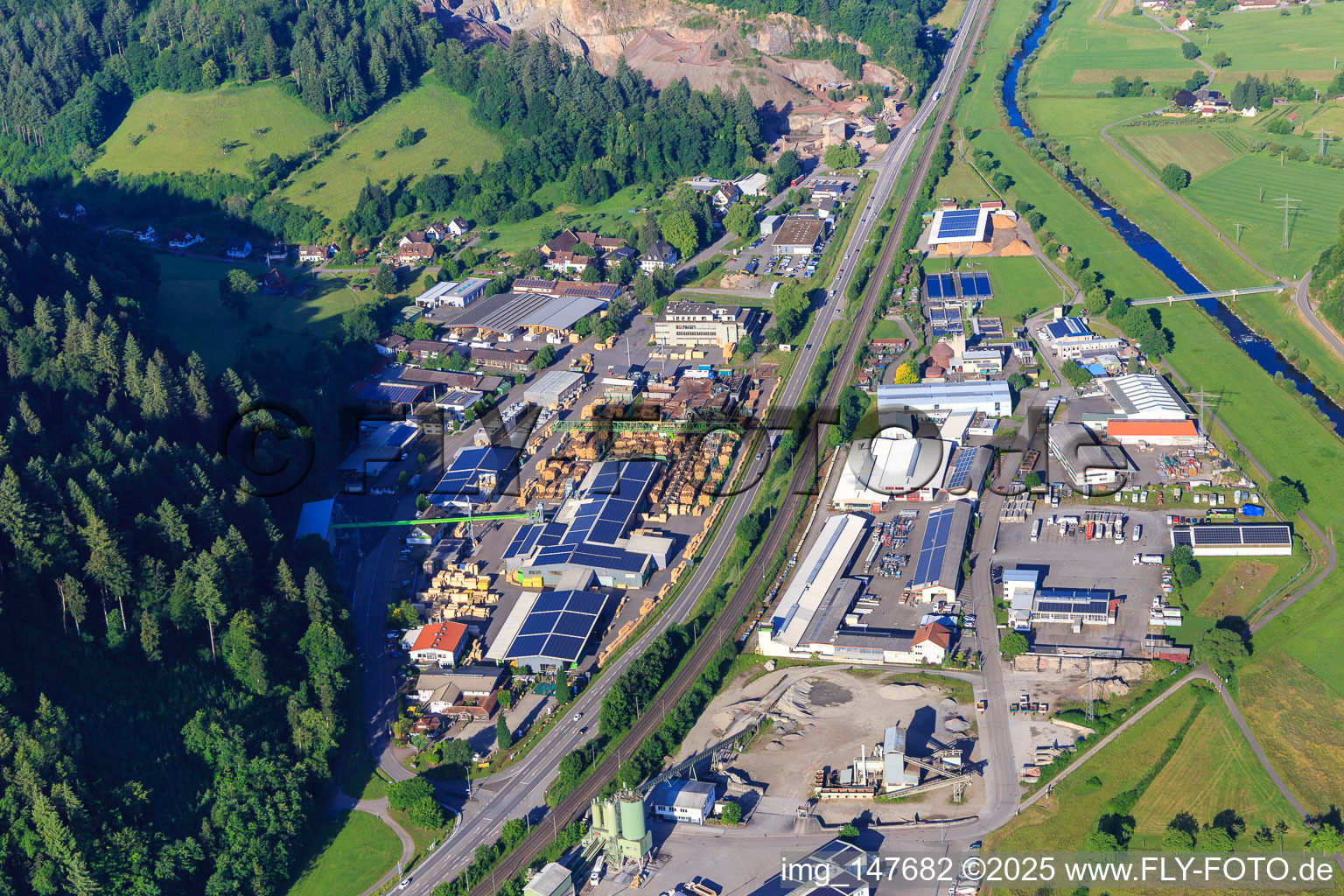 Aerial view of Industrial area on both sides of the B33 with Sägewerk Karl Streit GmbH & Co. KG, Kienzler Stadtmobiliar GmbH and Sievert Logistik SE in Hausach in the state Baden-Wuerttemberg, Germany