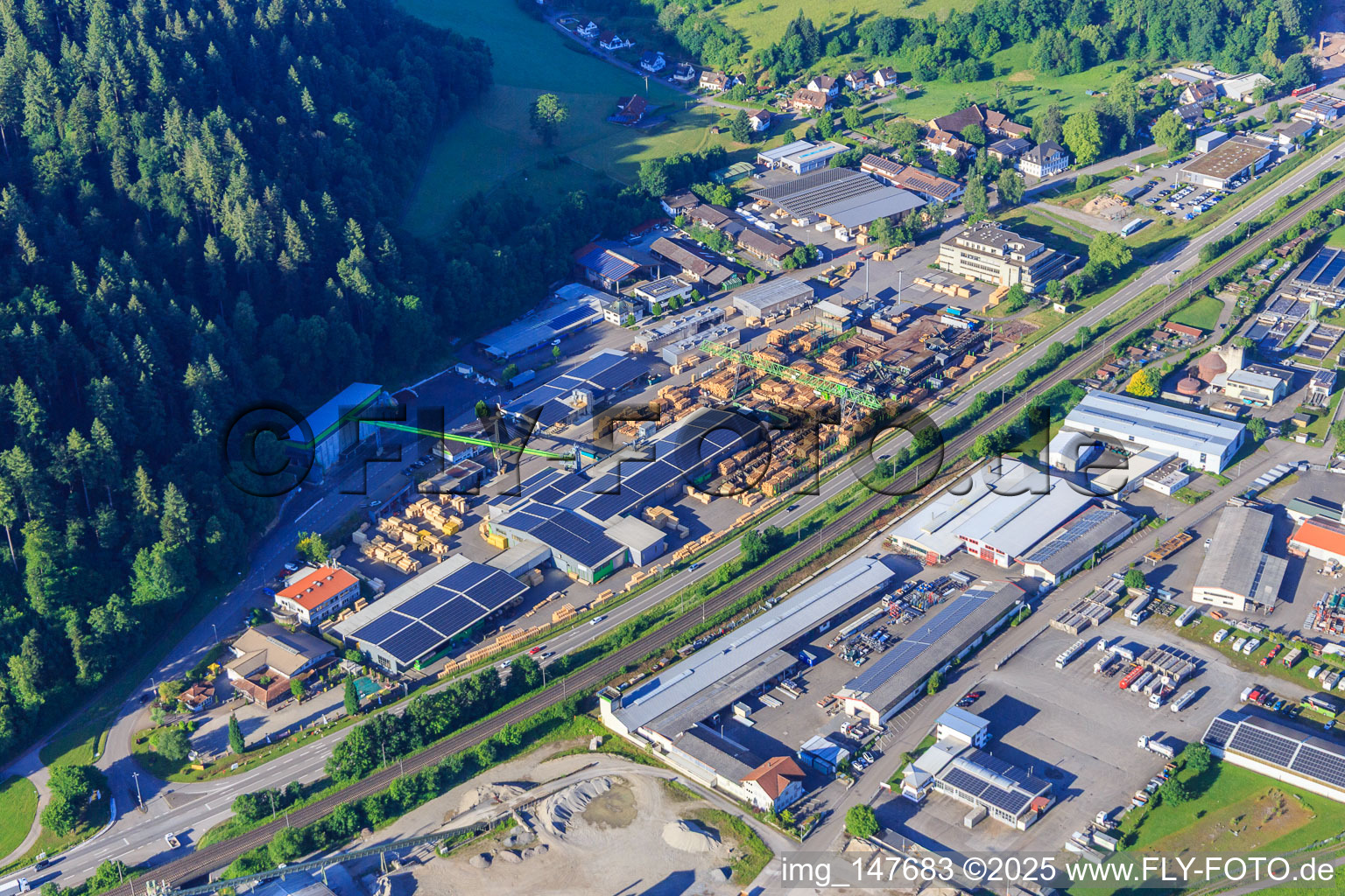 Aerial photograpy of Industrial area on both sides of the B33 with Sägewerk Karl Streit GmbH & Co. KG, Kienzler Stadtmobiliar GmbH and Sievert Logistik SE in Hausach in the state Baden-Wuerttemberg, Germany