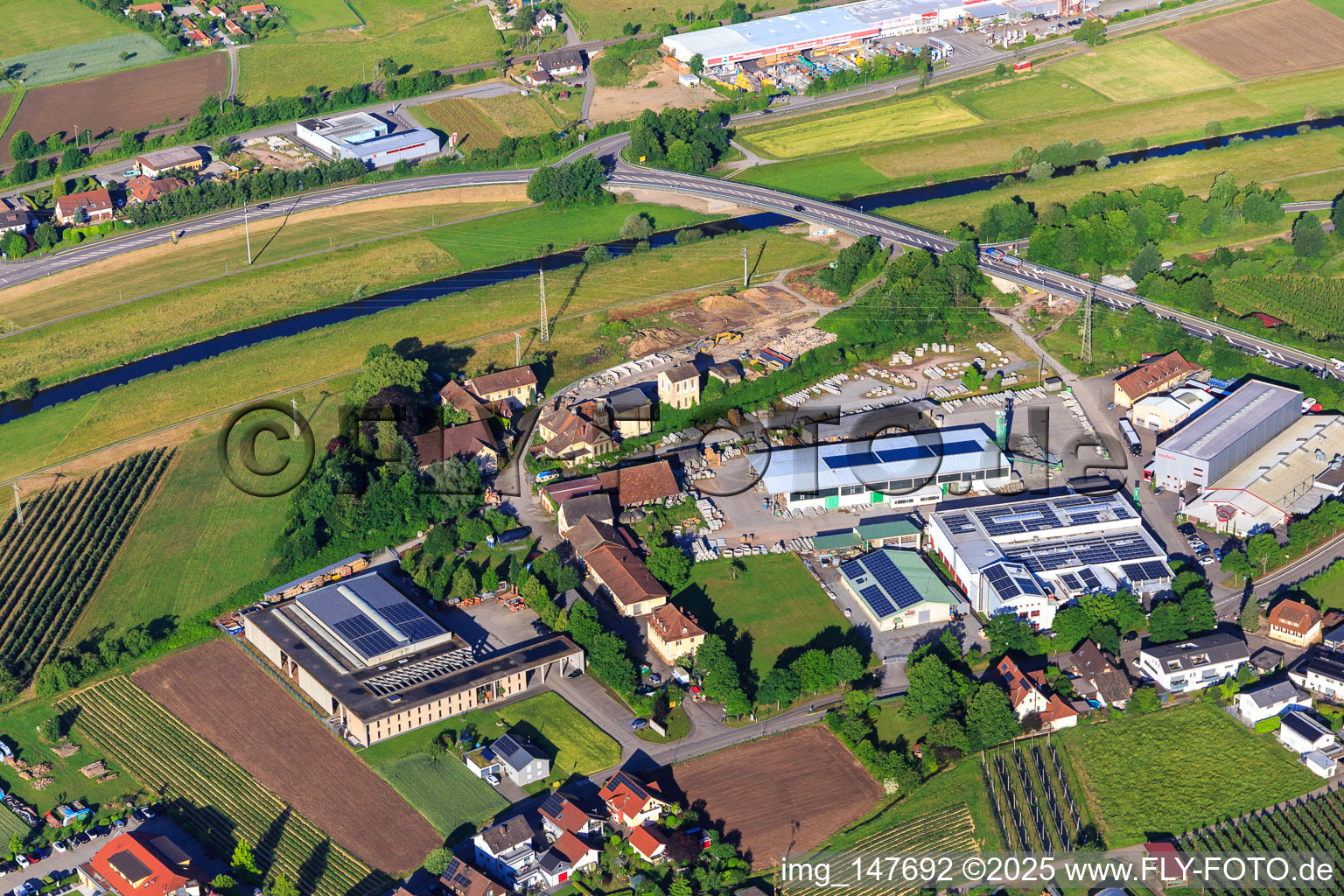 Grünweg industrial area at the Kinzig Bridge with Mabetec Painting and Varnishing Technology GmbH, mabetec Coating Technology GmbH, Spengler Roofing and Concrete Plant Mall GmbH in the district Bollenbach in Haslach im Kinzigtal in the state Baden-Wuerttemberg, Germany