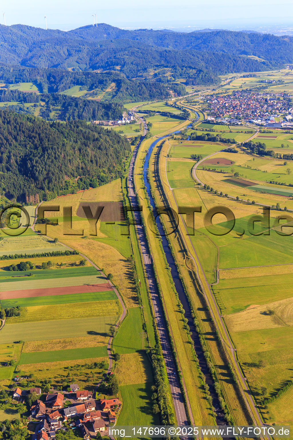 Straight course of the B33 parallel to the river Kinzig and the railway line to the northwest to Biberach in Steinach in the state Baden-Wuerttemberg, Germany