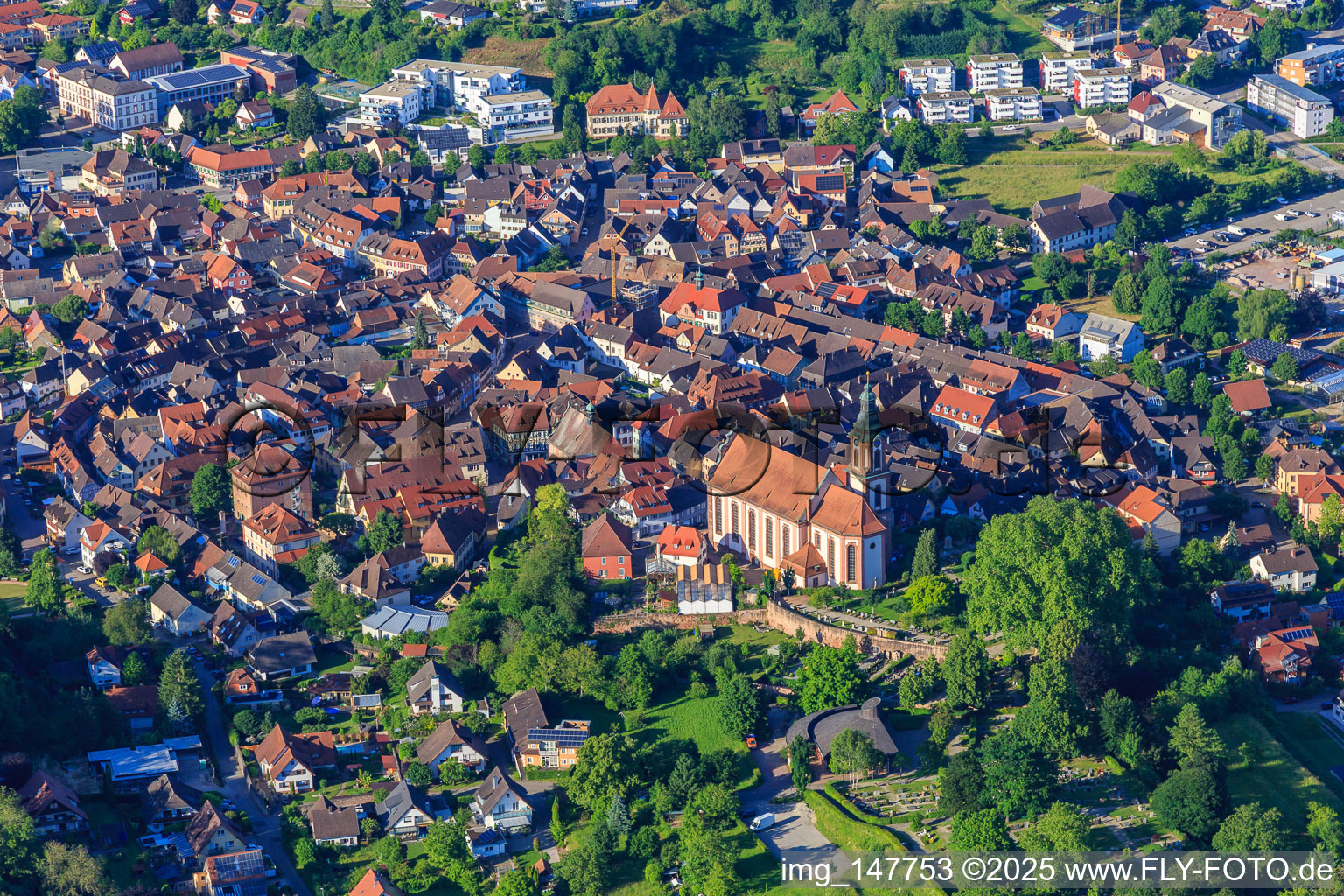 Aerial view of Baroque old town behind the Church of St. Bartholomew in Ettenheim in the state Baden-Wuerttemberg, Germany