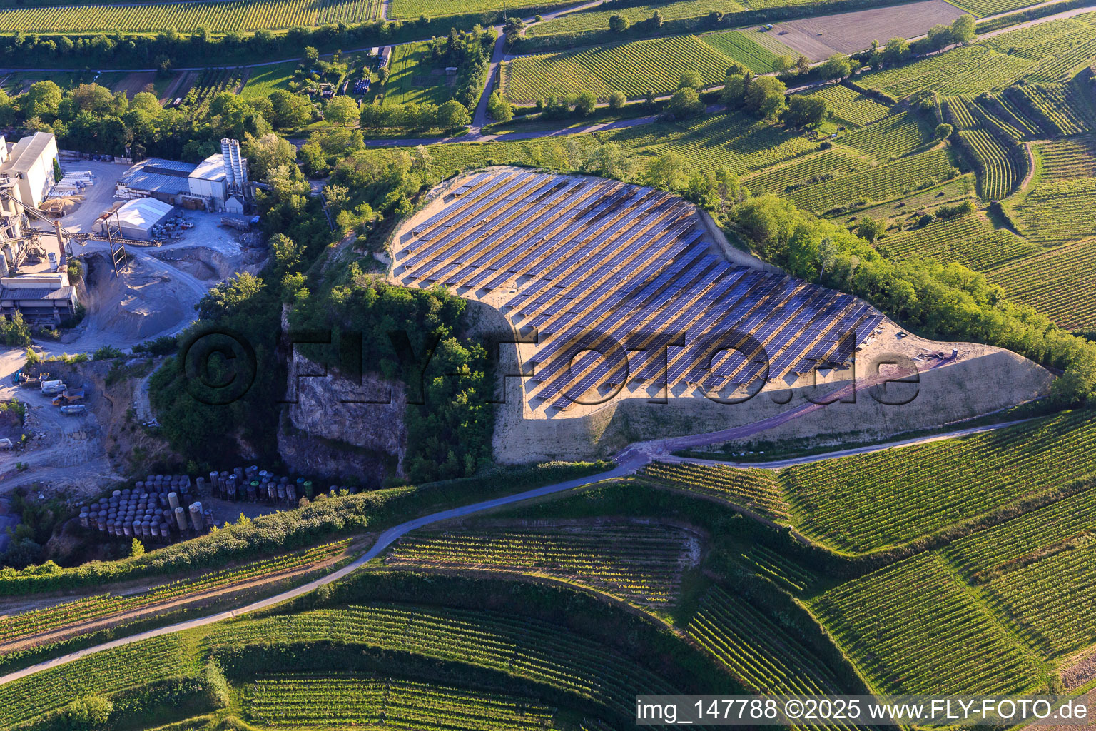 Photovoltaic open-space system on a spoil heap of the quarry Bötzingen of HANS G. HAURI KG Mineralstoffwerke in the district Oberschaffhausen in Bötzingen in the state Baden-Wuerttemberg, Germany