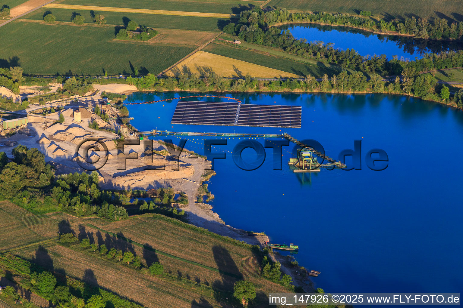 Aerial photograpy of Wyhl gravel pit with floating PV system of Hermann Uhl KG - Wyhl-Ort plant in Wyhl am Kaiserstuhl in the state Baden-Wuerttemberg, Germany