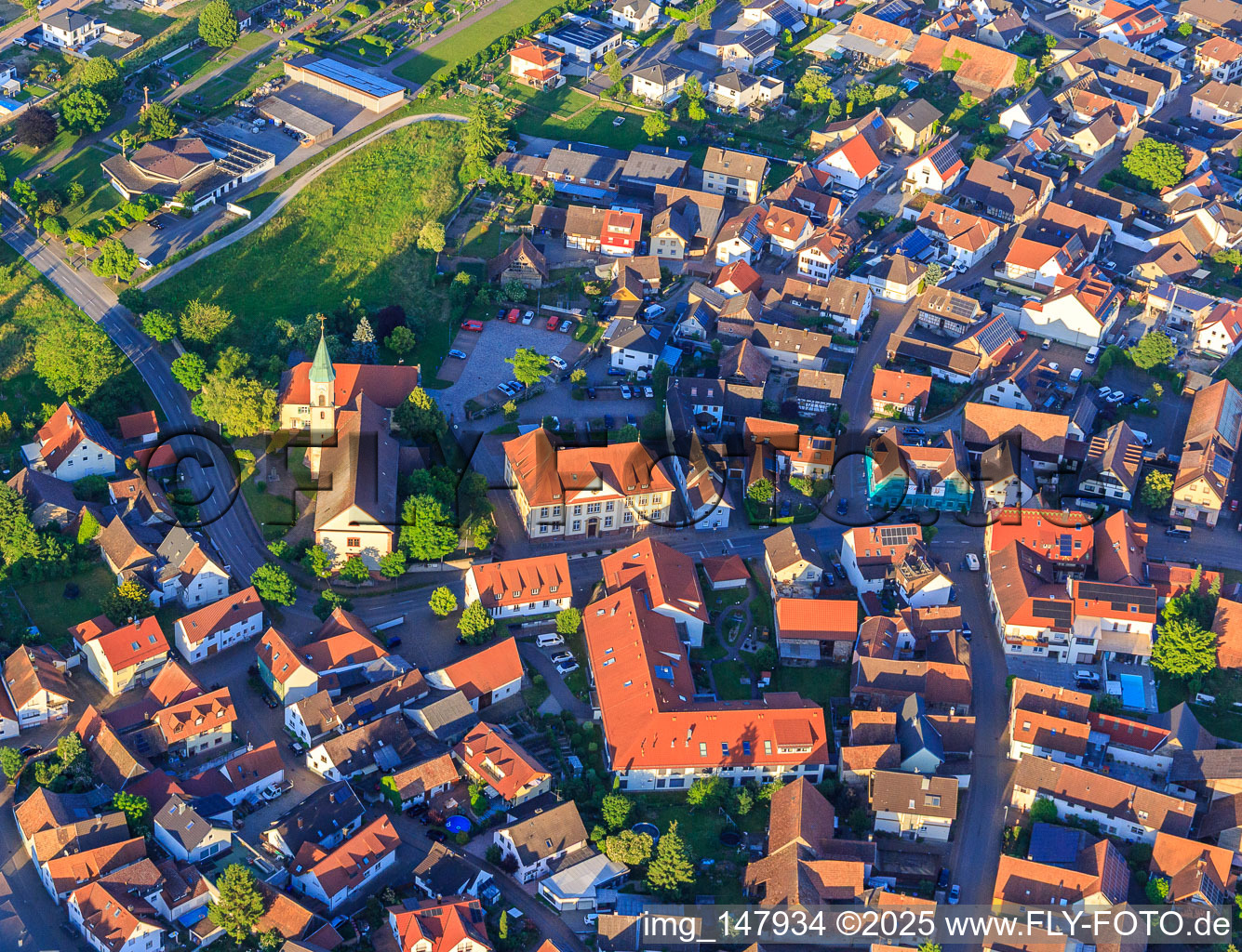 Aerial view of St. Blasius Church and BeneVit Haus Rheinaue nursing home in Wyhl am Kaiserstuhl in the state Baden-Wuerttemberg, Germany