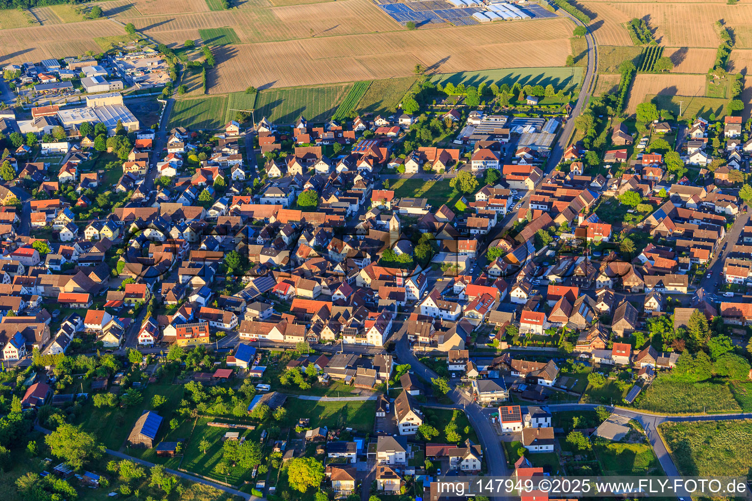 View of the town from the west with the Protestant church in Weisweil in the state Baden-Wuerttemberg, Germany