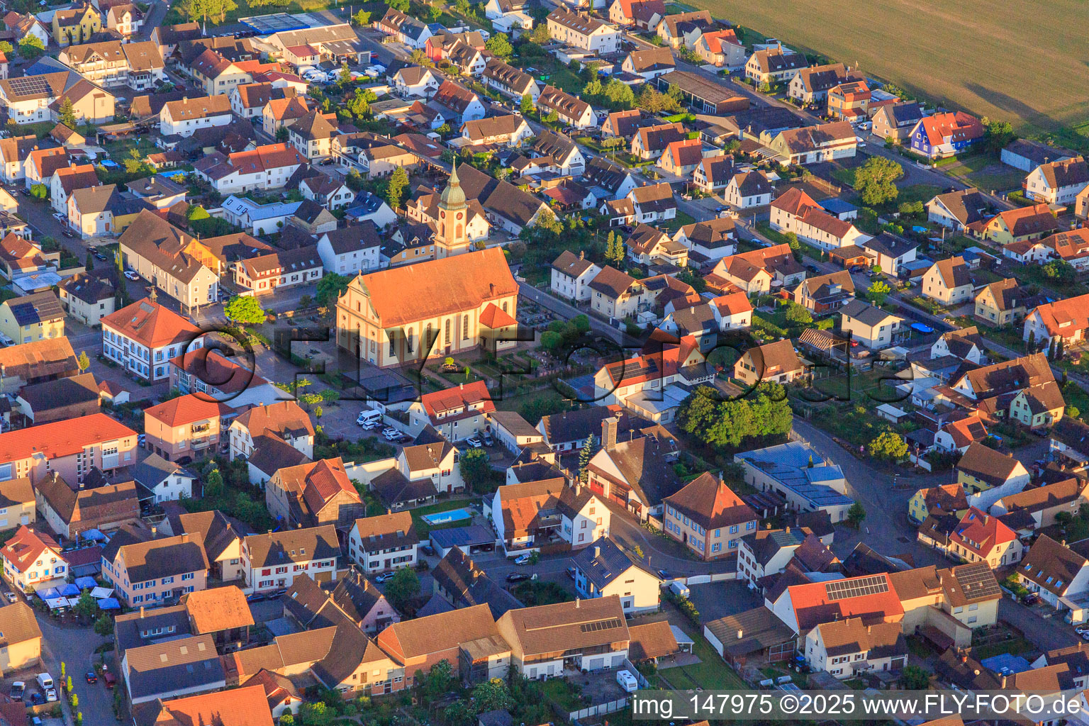Parish Church of St. John the Baptist and cemetery in the town center in Ringsheim in the state Baden-Wuerttemberg, Germany
