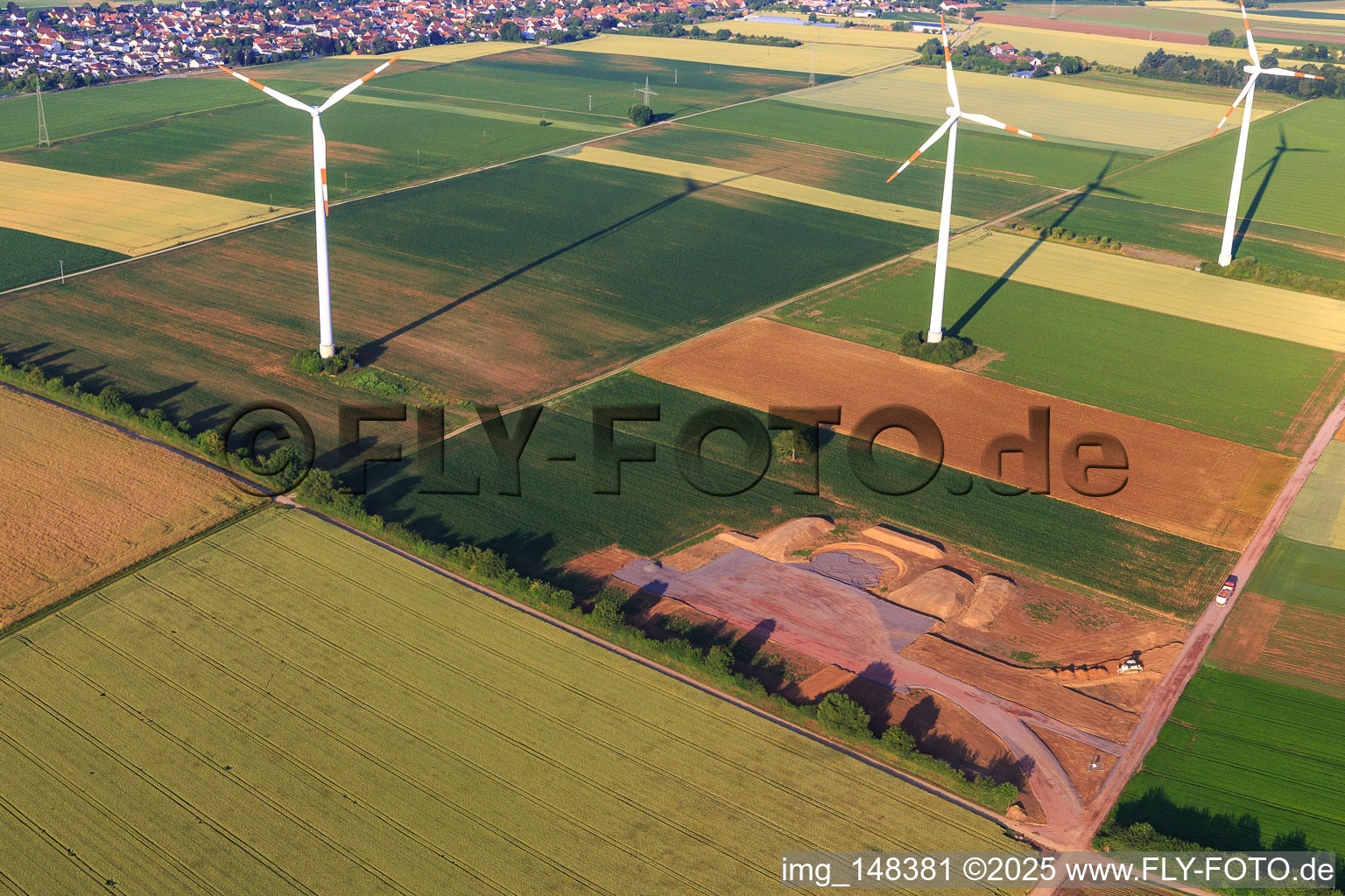 Aerial view of Repowering of the Minfeld wind farm. JUWI is replacing four older turbines (GE 1.5) from 2004 with two new, modern Vestas V162 turbines, each with a capacity of six megawatts. in Kandel in the state Rhineland-Palatinate, Germany