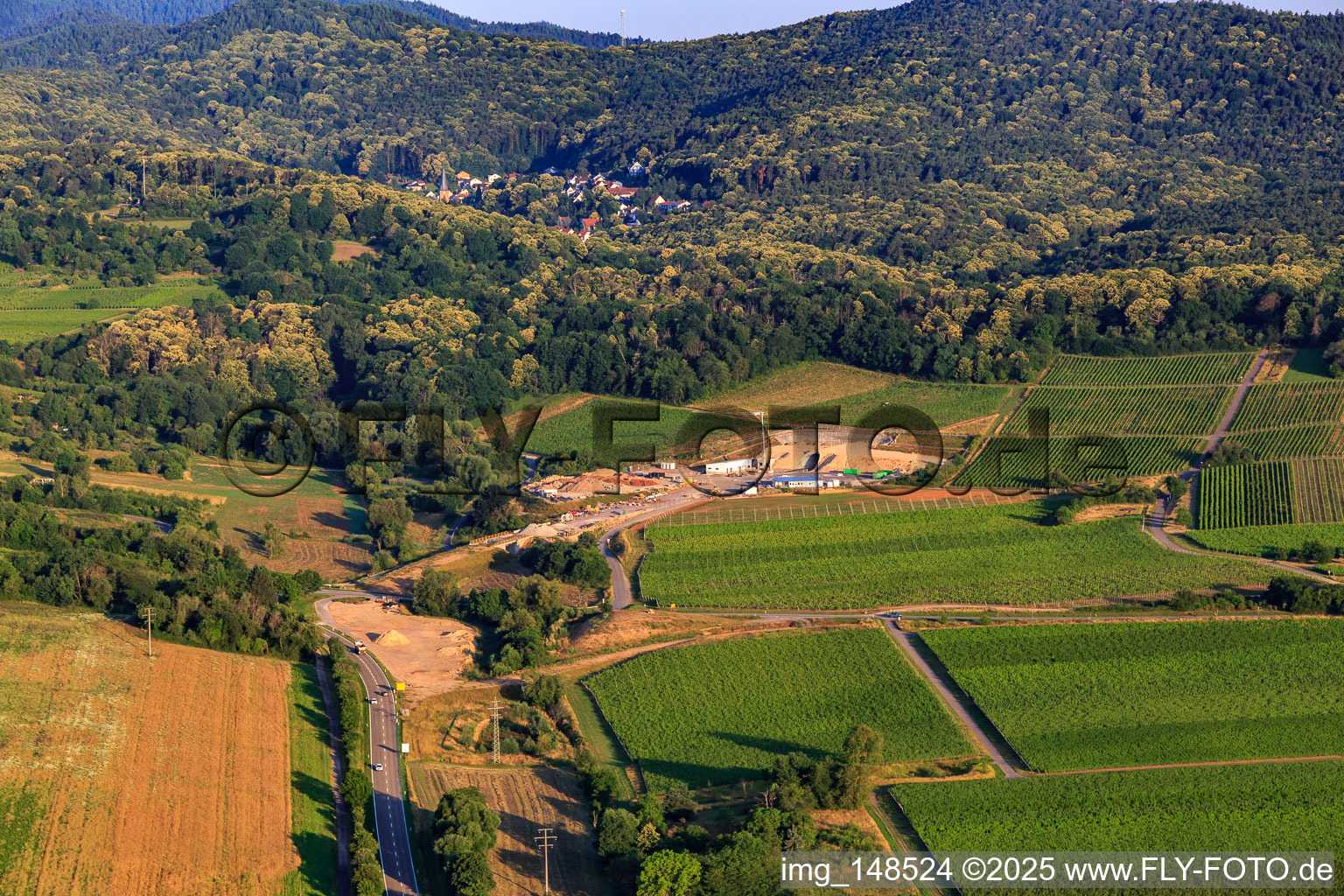 Construction site of the eastern tunnel portal for the Astrid Tunnel for the underpass and bypass of Bad Bergzabern between B38 (Weinstraße) and B427 (Kurtalstraße) in Dörrenbach in the state Rhineland-Palatinate, Germany viewn from the air