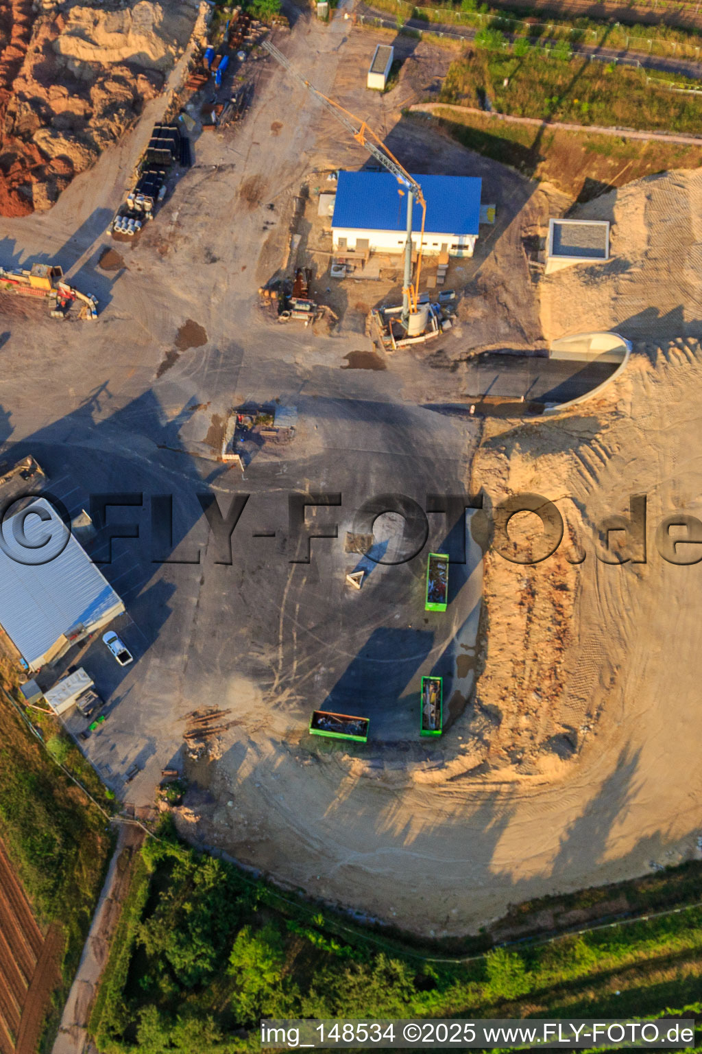 Construction site of the eastern tunnel portal for the Astrid Tunnel for the underpass and bypass of Bad Bergzabern between B38 (Weinstraße) and B427 (Kurtalstraße) in Dörrenbach in the state Rhineland-Palatinate, Germany seen from a drone