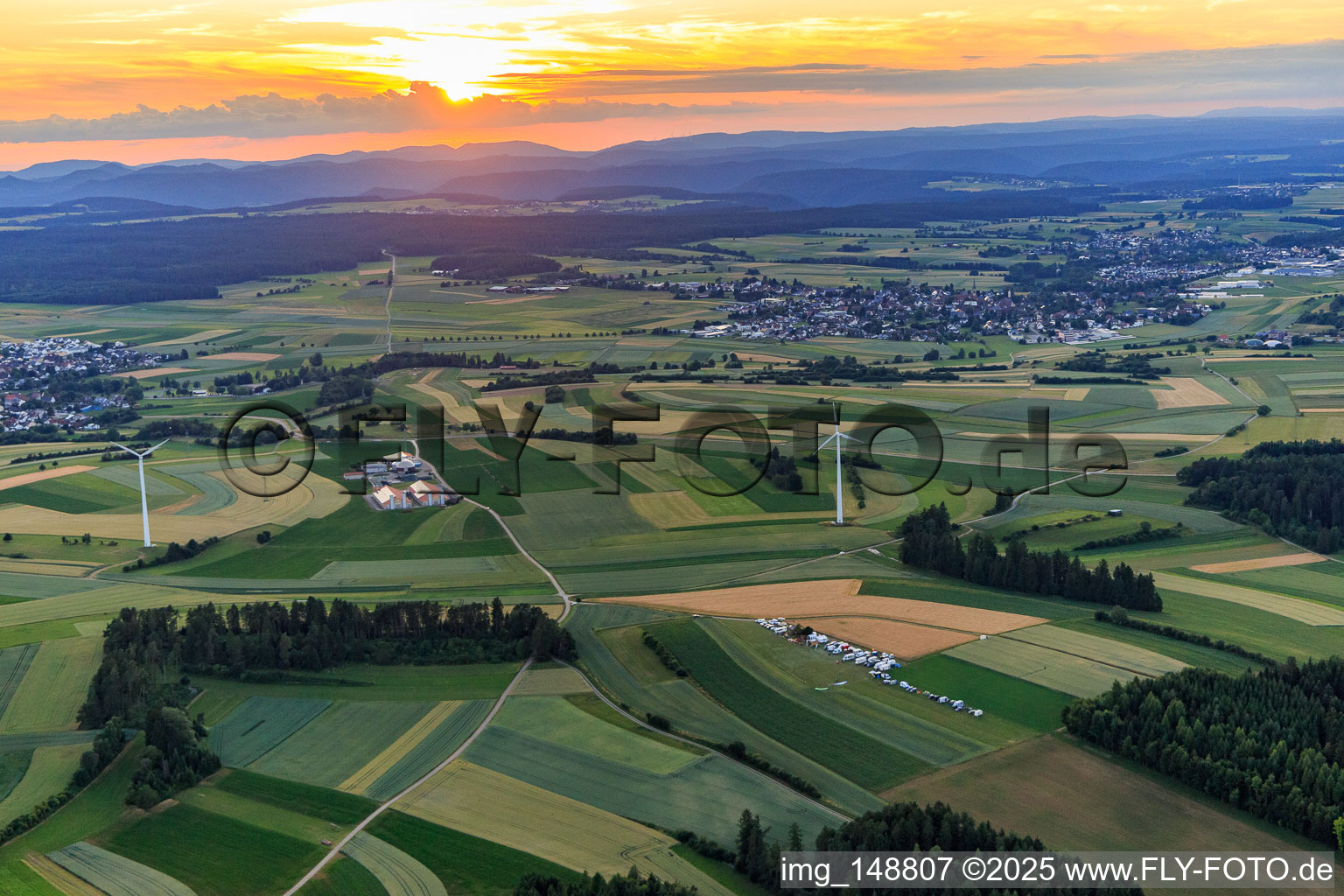 Aerial view of Sunset over the Black Forest with wind turbines in the district Waldmössingen in Schramberg in the state Baden-Wuerttemberg, Germany