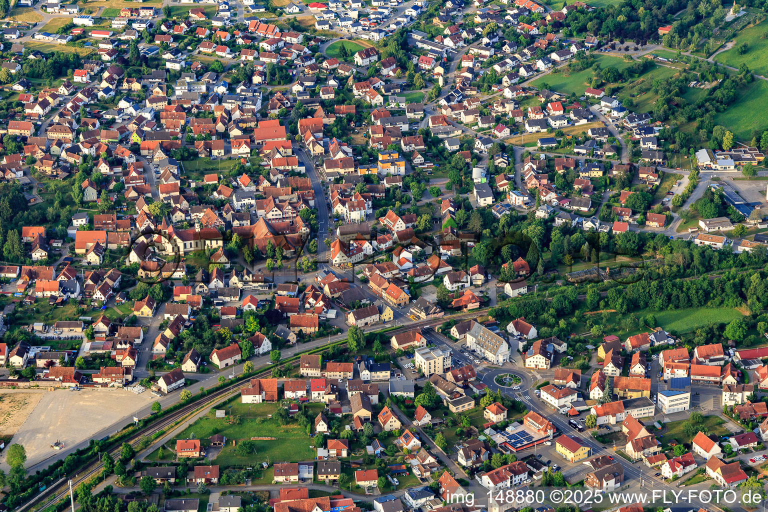 View of the town from the north with Hohenzollernhalle and St. Nicholas Church in the district Steinhofen in Bisingen in the state Baden-Wuerttemberg, Germany