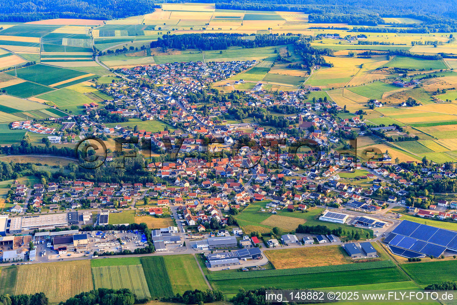 View of the town from the south with Winema Maschinenbau GmbH and CHROMOnorm GmbH in Grosselfingen in the state Baden-Wuerttemberg, Germany
