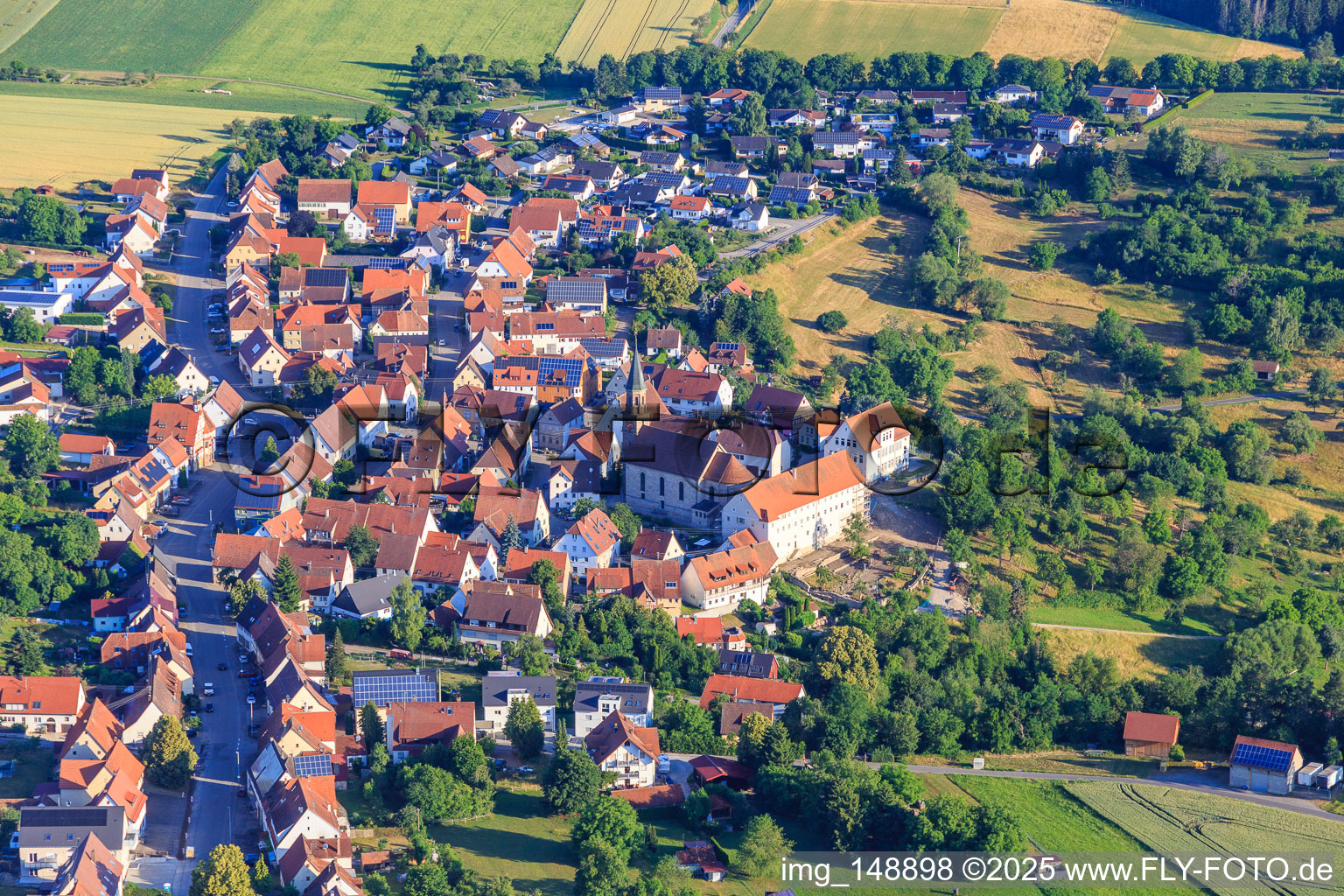Aerial photograpy of Historic town centre from the south with St. Markus Church, monastery and primary school in the district Binsdorf in Geislingen in the state Baden-Wuerttemberg, Germany