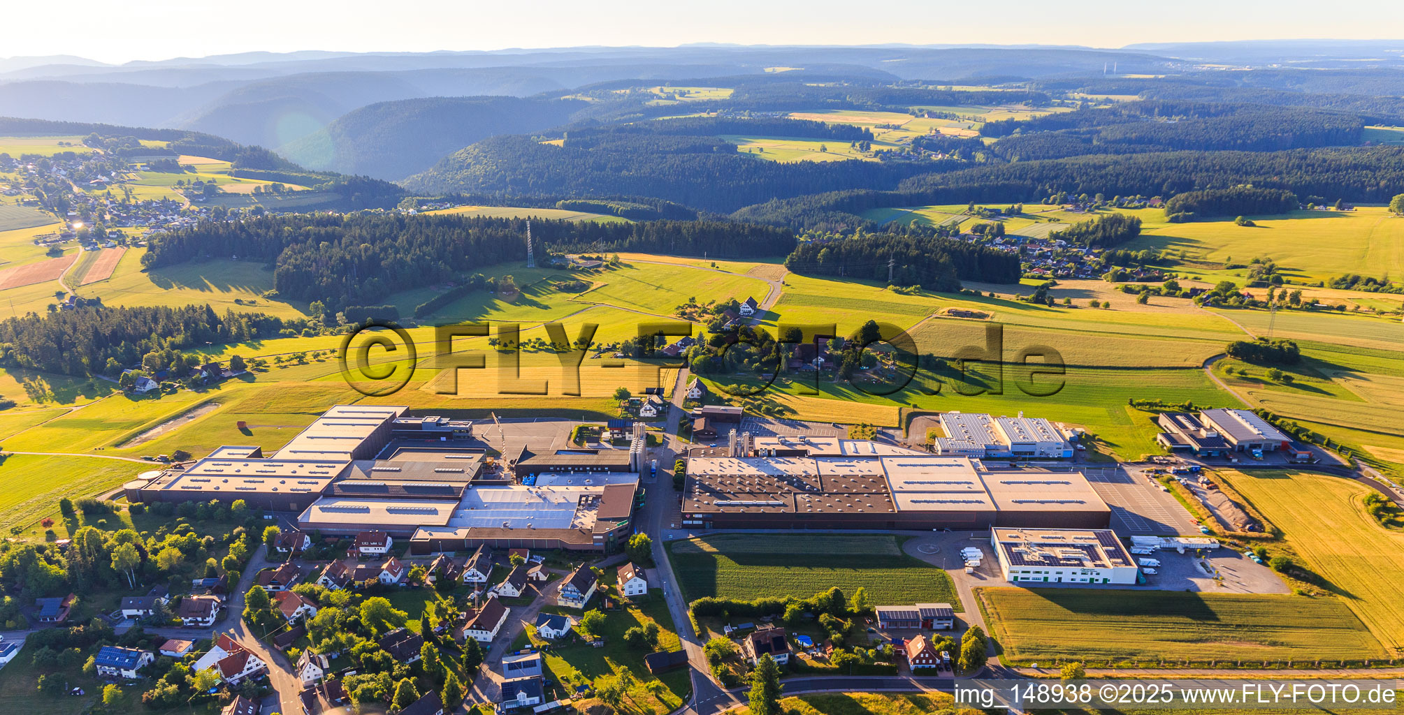 Aerial view of Village view from the south with GFV Verschlusstechnik GmbH & Co. KG, SAIER Verpackungstechnik GmbH & Co. KG and SAIER Group in the district Peterzell in Alpirsbach in the state Baden-Wuerttemberg, Germany