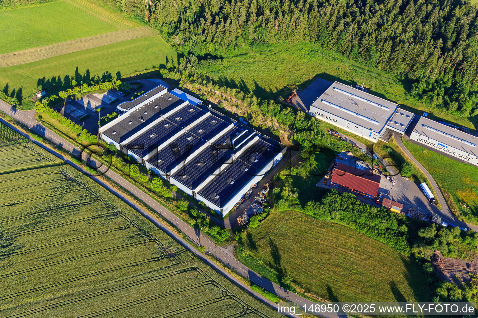 Aerial view of AIT Metallbearbeitung GmbH & Co. KG and Lohmüller Lodeco GmbH in the district Peterzell in Alpirsbach in the state Baden-Wuerttemberg, Germany