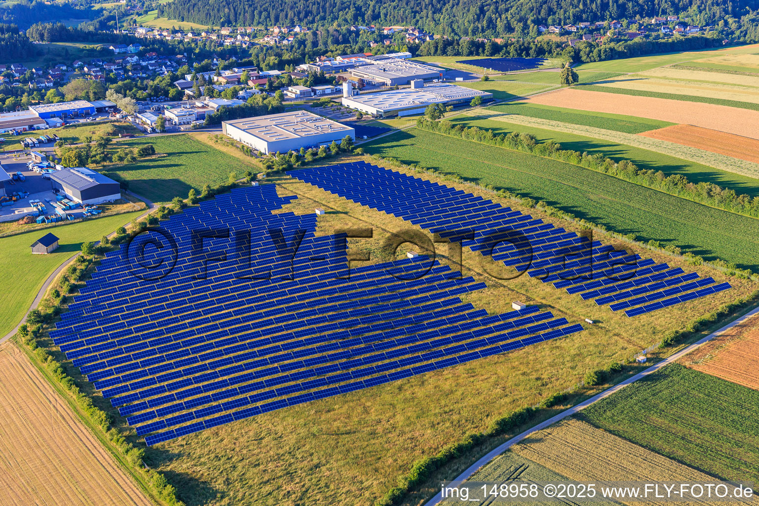 Open-space photovoltaic system in front of the Oberwiesachstraße industrial area in the district Betzweiler in Loßburg in the state Baden-Wuerttemberg, Germany