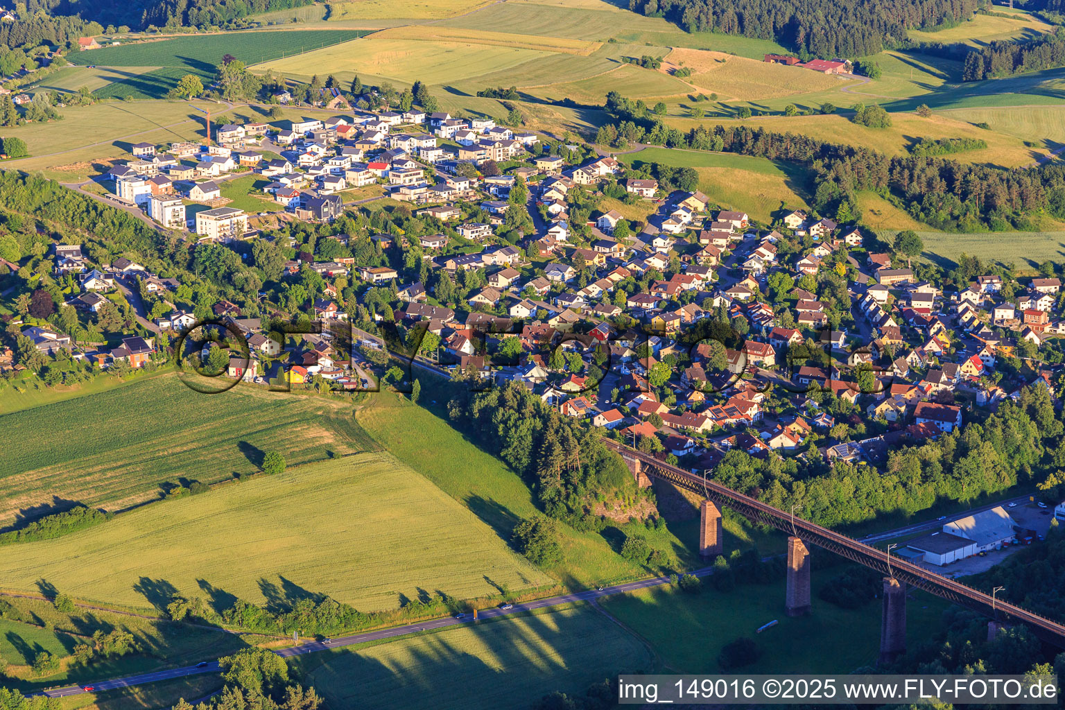 Village view behind the Kübelbach viaduct for the railway from the west in the district Aach in Dornstetten in the state Baden-Wuerttemberg, Germany