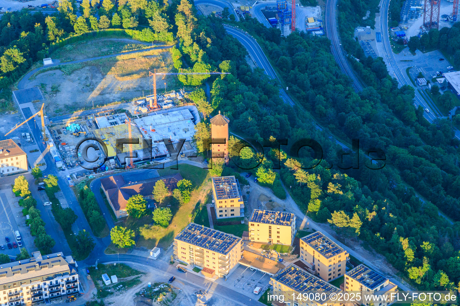 Geschwister-Scholl-Straße with water tower, VIA Horb eV and construction site at the former sports field on the Galgenberg in Horb am Neckar in the state Baden-Wuerttemberg, Germany