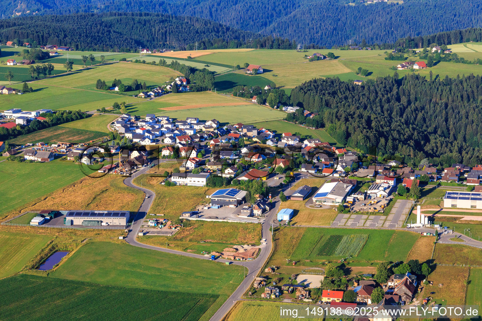 View of the town from the northeast with Hess Montagen & Bauelemente GmbH / Holzbau GmbH & Co.KG and Herzog Treppen und Holzbau GmbH in Aichhalden in the state Baden-Wuerttemberg, Germany