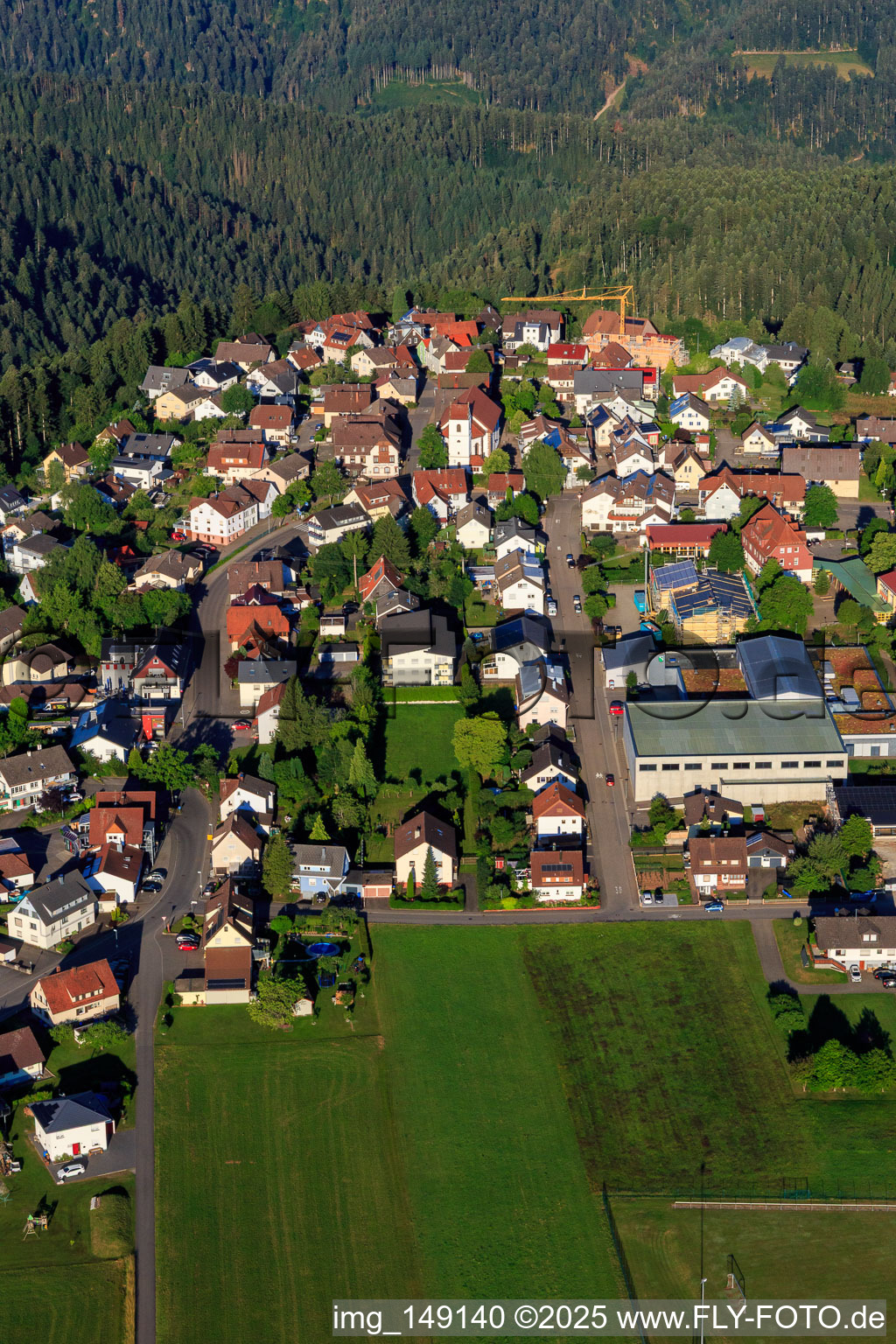 Aerial view of View of the town from the east with Josef Merz Hall in the district Vorderaichhalden in Aichhalden in the state Baden-Wuerttemberg, Germany