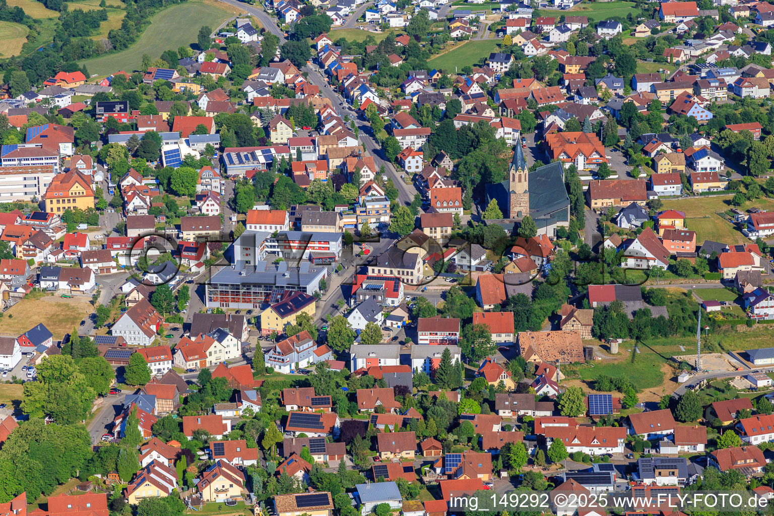 Town center with St. Martinus Church, Wehle sports hall and Volksbank Schwarzwald-Donau-Neckar eG in Dunningen in the state Baden-Wuerttemberg, Germany
