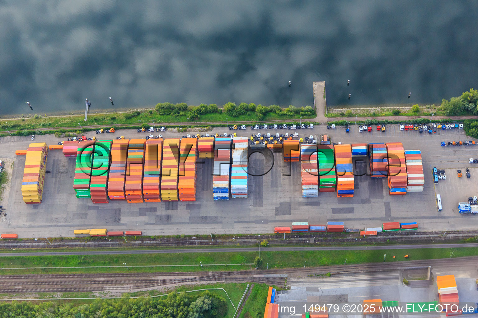 Colorful containers and trucks at the pier of Vega International Car-Transport at the Landeshafen Wörth in Wörth am Rhein in the state Rhineland-Palatinate, Germany